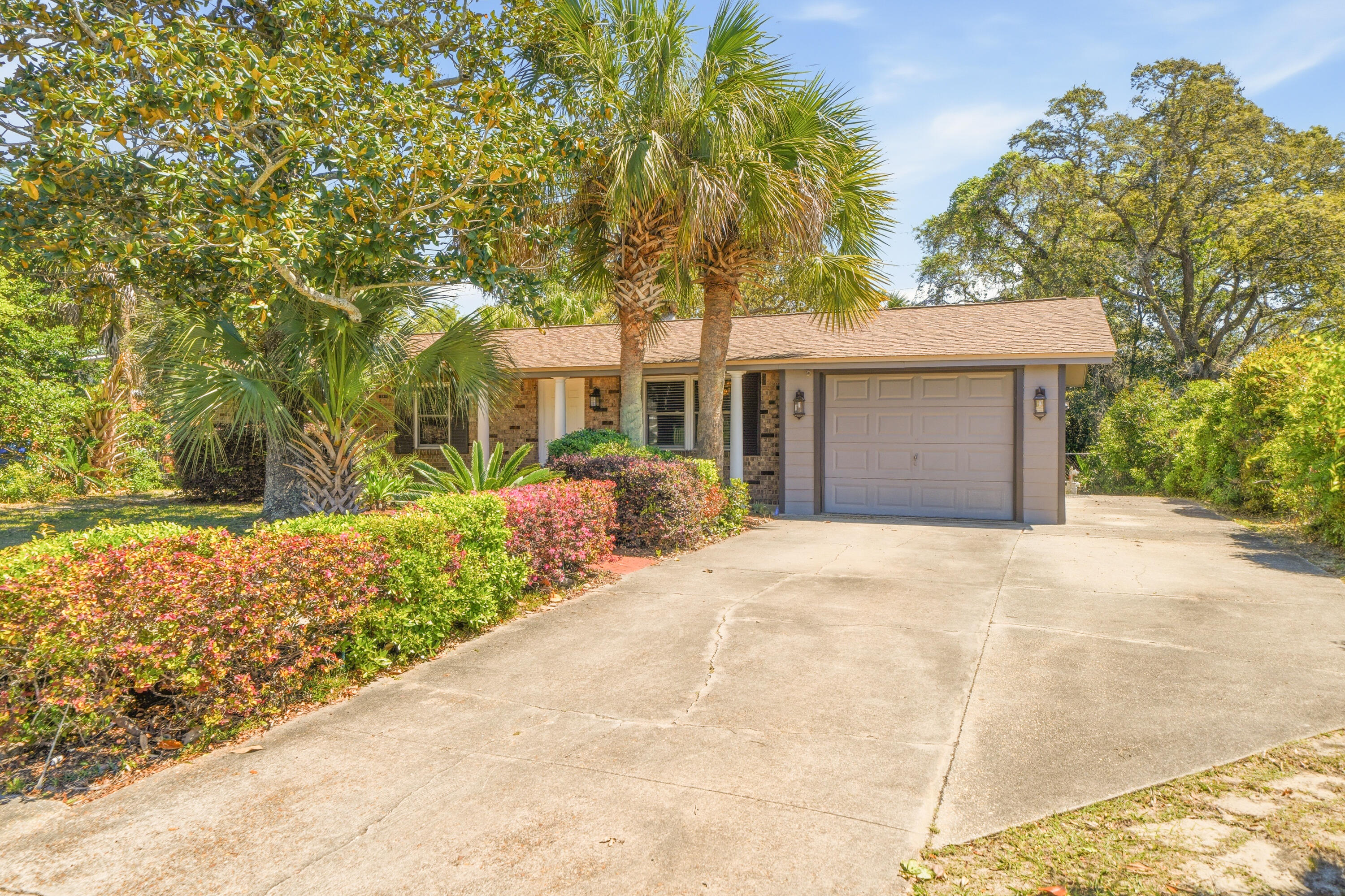 ***Assumable VA Loan with a very low rate***
Welcome to 417 NW Sherry Circle in the heart of Fort Walton Beach! This well-maintained home offers a spacious, open-concept layout with durable tile flooring throughout--perfect for easy maintenance and everyday living.
The kitchen features abundant cabinetry, stainless steel appliances, and generous counter space, flowing seamlessly into the living and dining areas--ideal for entertaining. The living room is warm and inviting with a beautiful stone fireplace and plenty of natural light.
Enjoy additional living space with a large screened-in porch, perfect for relaxing year-round while taking in views of the private backyard. The outdoor area is shaded by mature trees and offers ample space for a variety of outdoor activities. A detached workshop/shed provides excellent storage or workspace for tools, hobbies, or equipment.
Additional highlights include a functional layout with flexible-use spaces, an indoor laundry area, and ample parking with a driveway and attached garage.
Conveniently located with easy access to shopping, dining, and area beaches, this home offers a great combination of comfort and accessibility.
Don't miss your opportunity to own a property with both indoor and outdoor living space in a desirable Fort Walton Beach location!
