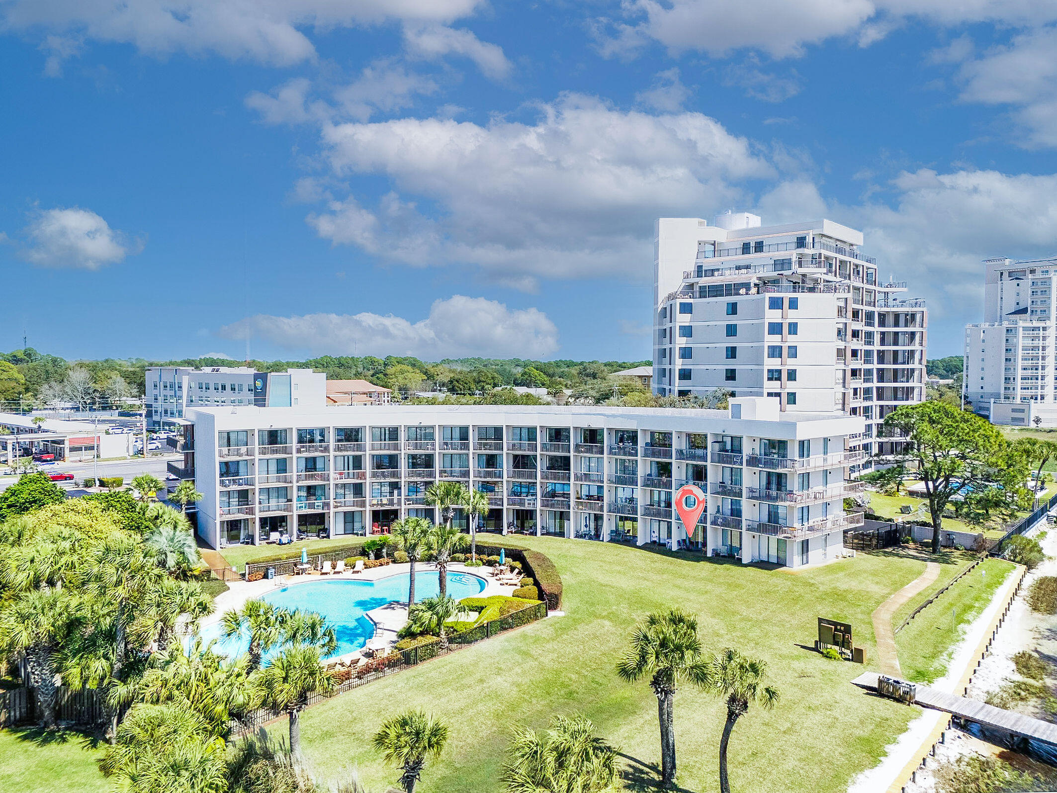 Enjoy coastal living at its finest with this beautiful fully furnished first-floor waterfront studio located at Pirates Bay Condominiums overlooking the tranquil waters of the Santa Rosa Sound in Fort Walton Beach, Florida. This charming unit offers an incredible opportunity as a vacation getaway, income-producing investment, or personal waterfront retreat. Positioned second from the end of the building, the condo sits just steps from the water and provides beautiful sound views from inside the unit, the back porch and even the front door.

Located directly along U.S. Route 98, Pirates Bay places you just minutes from the brilliant white sand beaches and emerald waters of Destin and Okaloosa Island, along with the dining, shopping, and entertainment of downtown Fort Walton Beach. The waterfront complex features several desirable amenities including a large in-ground pool, dock and waterfront access, an updated picnic area, and convenient kayak and bike storage for owners. Residents and guests can spend their days fishing from the dock, catching lunch or dinner from the sound, or simply relaxing while watching dolphins swim and play across the water.

Laundry facilities are located on each floor for added convenience, and owners are allowed to have pets. Whether you prefer to keep this coastal escape all to yourself or share it with visitors, short-term rentals are permitted, offering excellent flexibility and investment potential. Private boat slips are also available onsite for boat owners and may even be made available to renters, adding even more appeal to this waterfront opportunity.