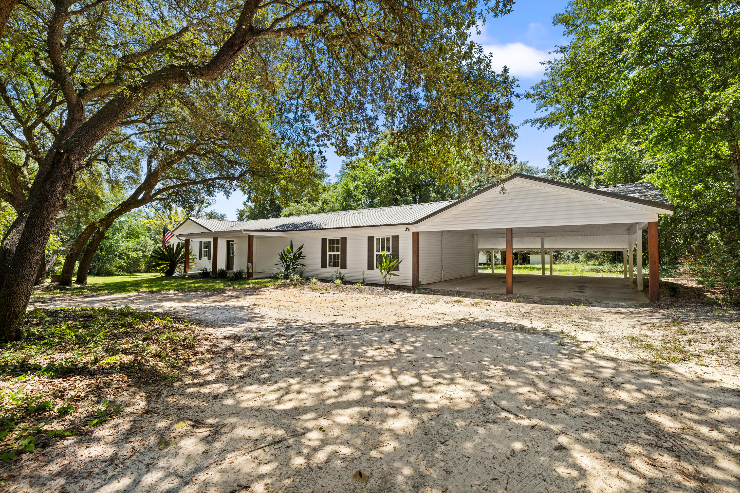 Charming farmhouse living on 4.05 acres! This 4BR/2BA home overs over 2,400 SF of space, including a sun-filled Florida room. Inside, the kitchen and baths have been tastefully updated while maintaining the warm country character that makes this home special.

Recent improvements provide peace of mind: HVAC, septic, water heater

The acreage is full of possibilities-grapevines, walnut trees, and blueberry bushes already thrive here, while a mix of open land and shaded woods gives plenty of room to garden, raise animals, or simply relax. An outbuilding with covered space offers storage or hobby use and conveys as-is.