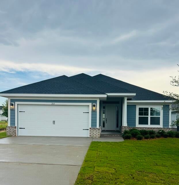 This popular Craftsman-style 4BR/2BA home (currently under construction: (Est. August / Sept. N ext to the entrance of the community (next to model). Designed with both comfort and style in mind, the home features HardieBoard® siding with a brick skirt, vaulted ceilings,  and CoreTec Pro Plus luxury vinyl plank flooring throughout--no carpet. The spacious primary suite boasts elegant tray ceilings, a generous walk-in closet, and a spa-inspired bath. Quartz countertops in the kitchen and baths, soft-close cabinetry, spacious covered patio complete this inviting home, perfect for relaxed everyday living and entertaining. Bluffs residents enjoy a community pool, and bathhouse, near the Florida Trail offering plenty of opportunities to get outside and enjoy the Florida life style.  Adams homes pays most of closing costs and offers $10K flex cash to buy down rate. *Pics are of a similar home.*Pics are of a similar home.*