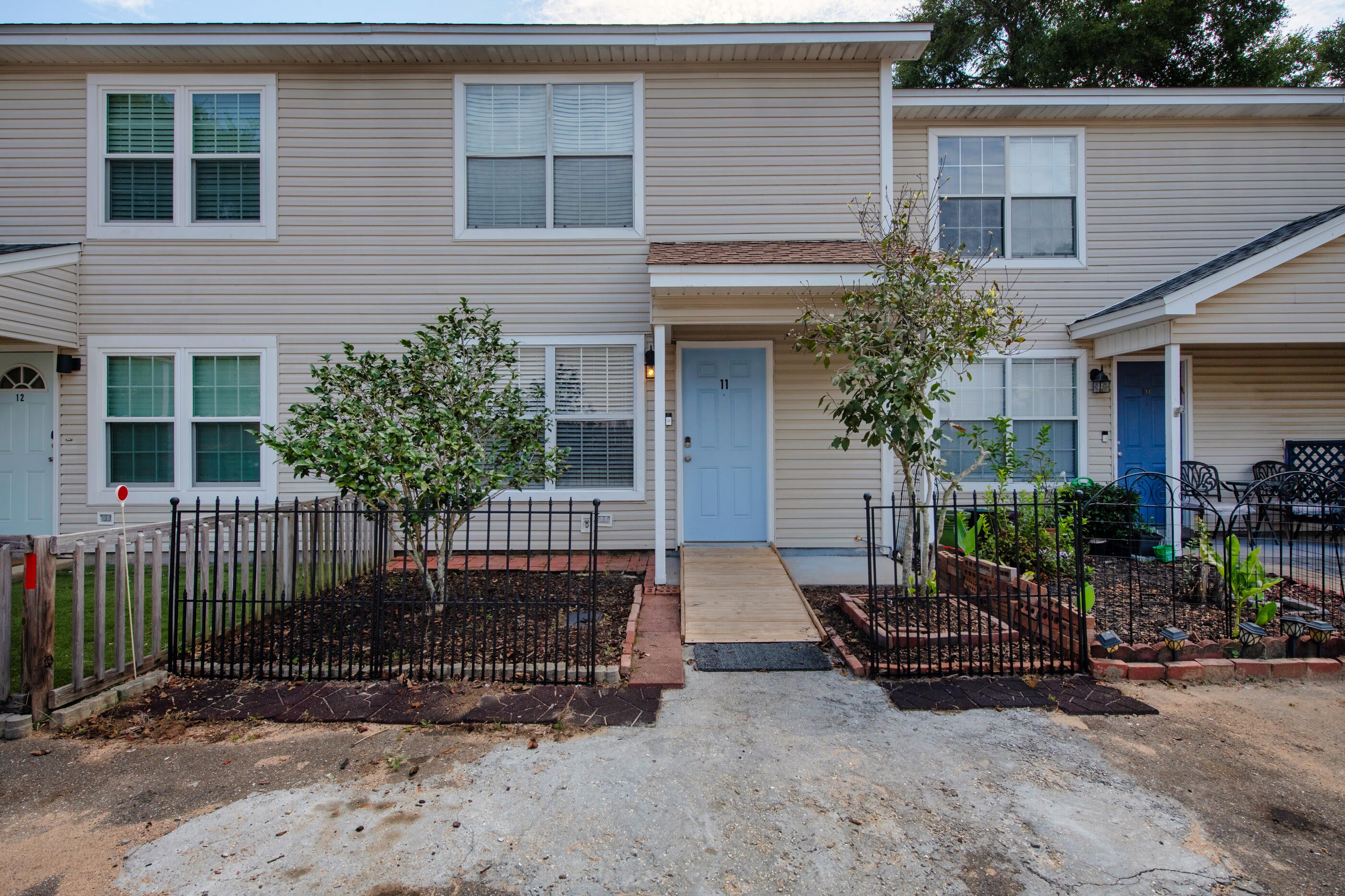 Welcome to Unit 11, where several major updates are already checked off the list! Updates completed include the roof, HVAC system, water heater, flooring and stainless steel appliances. Upstairs you'll find two bedrooms and one full bathroom, with a convenient half bathroom downstairs. The kitchen and dining area include a sliding glass door leading to the fenced backyard. Centrally located between both military bases, with convenient access to shopping and the beaches.
