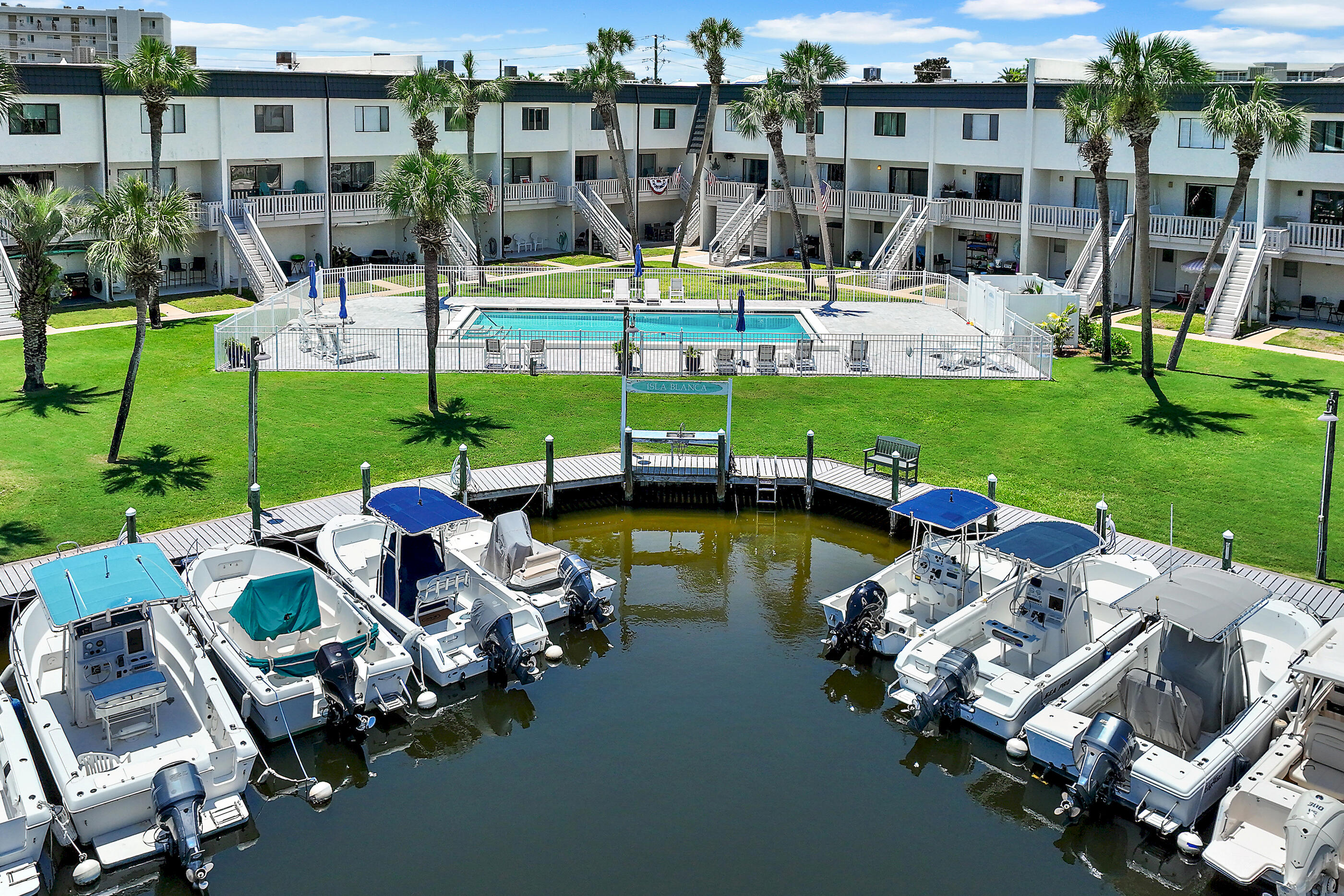 Isla Blanca offers the best of both worlds...beach living with deep water access for boaters. This 19 unit complex is water front, with boat docks, and is just a short walk to the beach. This unit has water views from the living room and master bedrooms. You'll love the sight of boats traveling through the canals. In addition, a spacious balcony is perfect for relaxing and reading a book or enjoying a glass of wine. Complex has a large community pool that is perfect for lounging. Isla Blanca offers the finest of Island living to both permanent residents or second home owners.