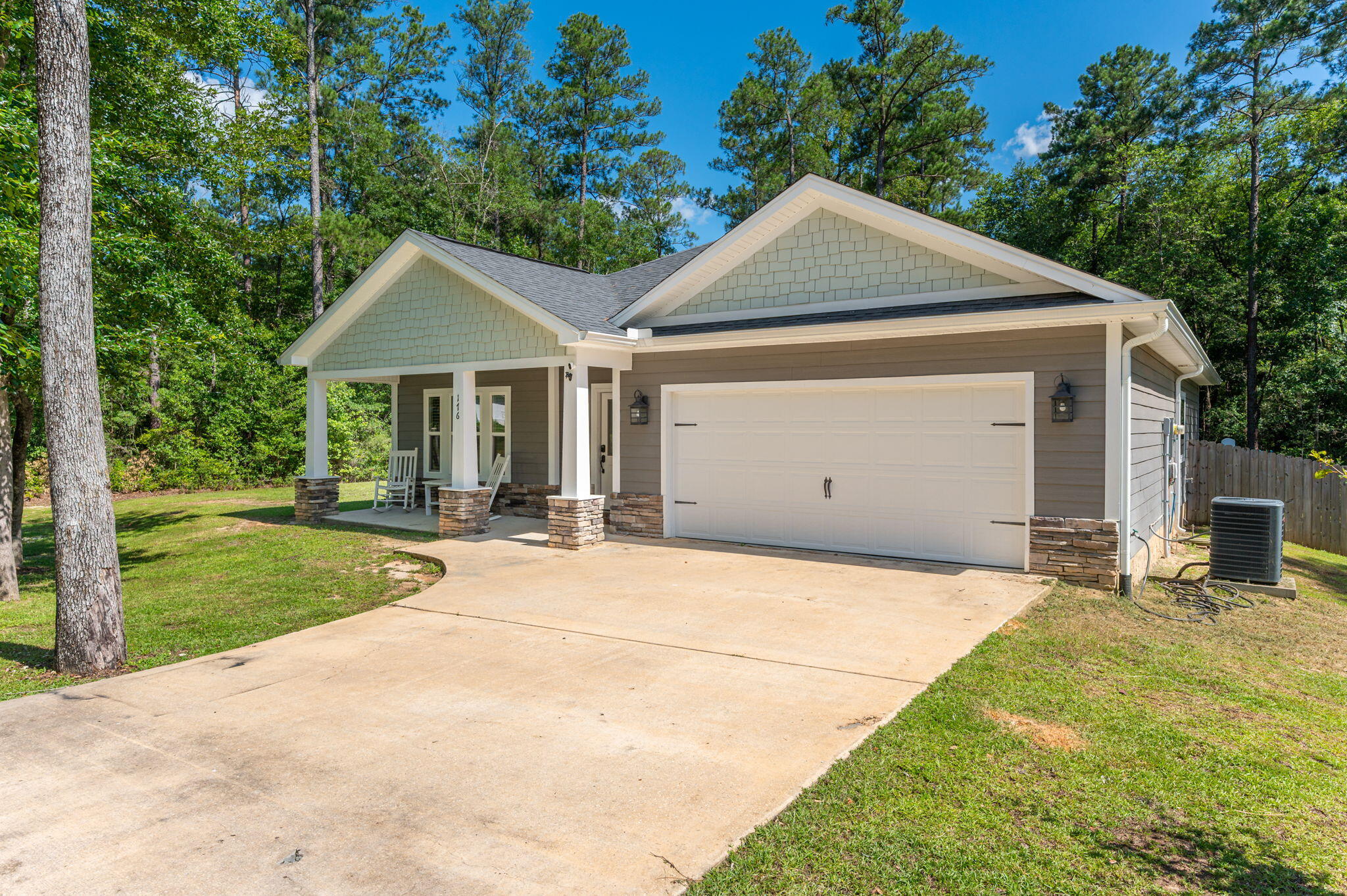 Beautiful 3-bedroom, 2-bath home situated on a full one-acre lot in the picturesque Indian Trails community. This charming home offers exceptional curb appeal with a welcoming front porch and an attractive exterior featuring Hardie board siding complemented by stone accents. Inside, you'll find a bright, open-concept floor plan designed for comfortable everyday living and entertaining. The spacious kitchen boasts abundant cabinetry, granite countertops, stainless steel appliances, a breakfast bar, and an adjoining dining area. The large living room provides plenty of space to relax and gather with family and friends. The private primary suite features a generous walk-in closet, dual vanities, a garden tub, and a separate shower. Two additional guest bedrooms are well-sized and share a full bathroom. Additional highlights include a two-car garage, a large fenced section of the backyard that's perfect for pets or play, and an expansive wooden deck ideal for outdoor entertaining. Enjoy the privacy and tranquility of country-style living while still being conveniently located to nearby amenities. Owners will have full use of Indian Trail's amenities, including Arrow Lake (10 acres), Tilley's Lake (4 acres) and a 2-acre park with picnic tables and barbecue stands. Buyer to verify all information.