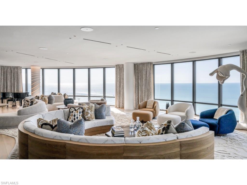Welcome to The Regent, Penthouse 2, an extraordinary Gulf-front residence in one of Naples, Florida’s most prestigious condominium buildings. Completely reimagined through an expert collaboration between the renowned Suzanne Lovell Inc., one of Architectural Digest’s top 100 international interior design firms, and master craftsmen from Kurtz Homes and Thomas Riley Artisans’ Guild, this home embodies a harmonious blend of interior design ingenuity and refined luxury. From the moment one steps from the private elevator into the grand entryway, one is welcomed by panoramic views of the Gulf of Mexico. The expansive great room is designed with an open flow to maximize light and breathtaking vistas. With multiple seating areas, a fully appointed bar, and seamless transitions to the dining room, this space sets the stage for gracious living and entertaining. Every element in this home has been thoughtfully customized to balance sophistication with relaxation. Penthouse 2, the only residence on the entire floor, occupies just over 12,000 square feet under air, consisting of four bedroom suites, two offices, media room, cabana room, game room, kitchen, family room, and space for exercising. Numerous terraces offer the residents various opportunities to enjoy exhilarating views of Naples and the shores of the Gulf of Mexico. The interior design embraces texture and artistry, from light wood flooring and shiplap walls to rope and woven leather accents. This rich palette serves as a backdrop for curated fine art and collectible furnishings, creating a home that is at once chic and informal. Penthouse 2 is more than a residence; it is a testament to inspired design, meticulous craftsmanship, coupled with the unmatched beauty of its oceanfront setting. Whether hosting grand gatherings or enjoying quiet family moments, this home is a sanctuary of elegance and comfort, perfectly tailored for modern living. Experience the pinnacle of luxury condominium living in Naples, Florida!