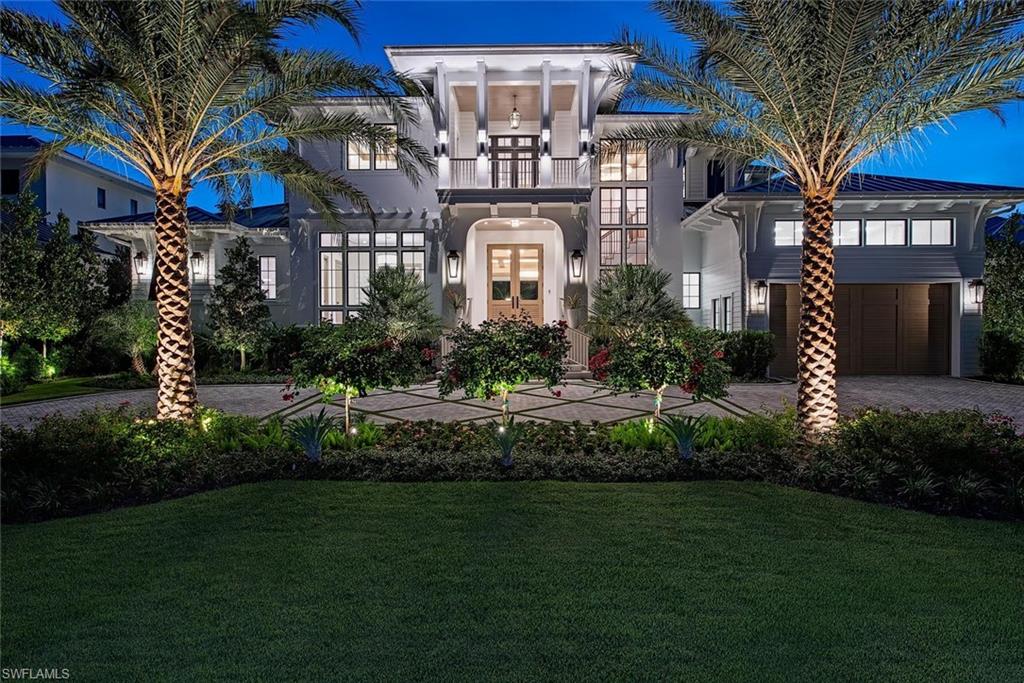 VIV Homes and MHK Architecture have combined forces to present a timeless new residence situated on an oversized, western-exposure 100' x 165' homesite just steps from Third Street South’s renowned shopping and dining and Naples’ pristine white-sand beaches. Offering nearly 7,200 square feet of air-conditioned living space, the residence features 6 bedrooms plus a study, 8 full and 1 half baths, a 5-car garage, upper-level lounge, VIP suite, and a flexible sixth bedroom with a striking steel-and-glass window wall, ideally suited as an exercise room, additional study, or sitting area. Full concrete construction, including a poured-concrete upper-floor system, is complemented by bespoke finishes and natural gas service. The interiors showcase Legno Bastone Lancaster wide-plank wood flooring, Italian-made Poliform closets, extensive rare natural stone selections, a fireplace, gourmet kitchen with separate service kitchen, two laundry rooms, elevator, and air-conditioned garages. Sophisticated technology includes Lutron HomeWorks lighting and shade control, integrated security cameras, Sonos audio, automatic water shutoff, and automated privacy shades throughout, including blackout channels in all bedrooms. Designed for exceptional indoor-outdoor living, the expansive exterior entertaining area centers around a huge resort-style infinity-edge pool overlooking a large, fenced artificial-turf yard. Highlights include a sun shelf with Tuuci umbrella, fireplace, built-in fire pit area with quartzite waterfall feature, and an oversized outdoor kitchen with Evo griddle, Wolf grill, and island. Automated roll-down screens and shutters allow the outdoor living spaces to transition seamlessly for year-round enjoyment, while a 60 kW generator provides peace of mind. A truly unrivaled combination of scale, construction quality, architectural distinction, and proximity to the very best of downtown Naples.