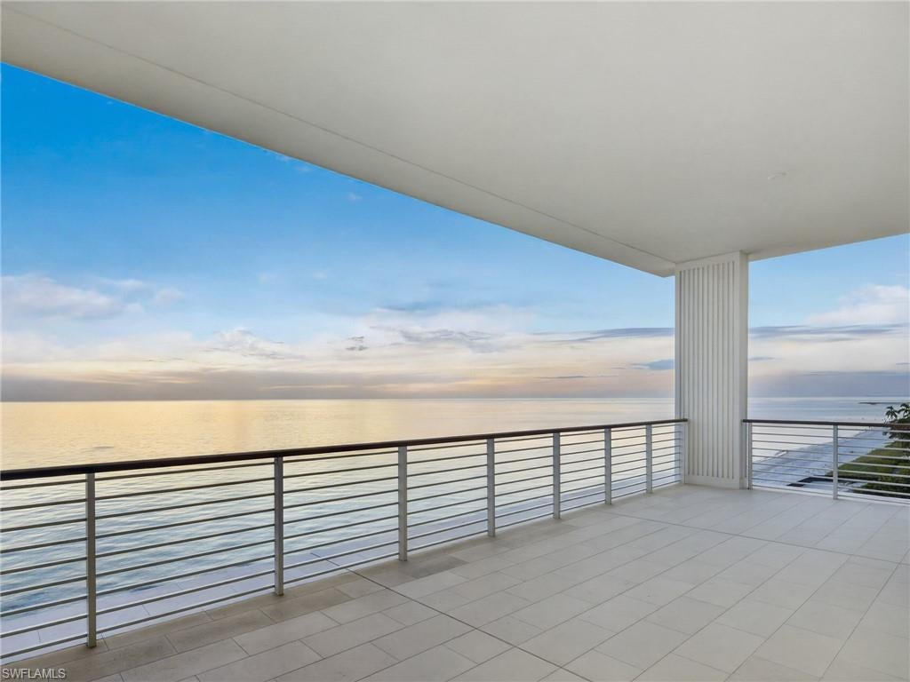 Newly completed and beautifully positioned along the shoreline, Residence C502 at the Residences at Naples Beach Club, a Four Seasons resort, pairs expansive Gulf views with the comfort and discretion of a private coastal home. Its exceptional beachfront setting places the sand and sea at the forefront, with uninterrupted western vistas extending toward the horizon.

A private elevator opens to a dedicated arrival foyer, introducing an airy interior where refined architectural details, bespoke millwork and thoughtfully selected finishes establish an understated elegance. Broad expanses of glass draw the coastline into the principal living spaces, while the open layout creates a natural connection between the kitchen, living and dining areas. Premium appliances and a conveniently positioned wet bar make the home equally suited to quiet evenings and gracious entertaining.

The living and dining spaces extend onto a generously proportioned covered terrace, creating an inviting setting for alfresco meals, sunset gatherings and leisurely afternoons overlooking the Gulf. An outdoor kitchen completes this seamless extension of the interior.

The primary suite shares the residence’s captivating water views and opens directly to the terrace. Its thoughtfully divided bath and dressing areas offer exceptional personal space, complemented by substantial walk-in closets. A separate guest wing accommodates three additional suites, each with a private bath. Among them, a spacious VIP retreat enjoys a terrace of its own.

Within this intimate collection of beachside residences, C502 offers an exceptional resort lifestyle. Inviting pools, beautifully maintained beachfront surroundings and attentive seaside service encourage unhurried days by the water. Distinctive dining, elegant gathering spaces, and thoughtfully appointed spa and fitness facilities offer opportunities for both recreation and relaxation. Personalized Four Seasons residential service lends ease to every arrival and departure, creating a welcoming coastal retreat for extended stays and spontaneous escapes to Naples.