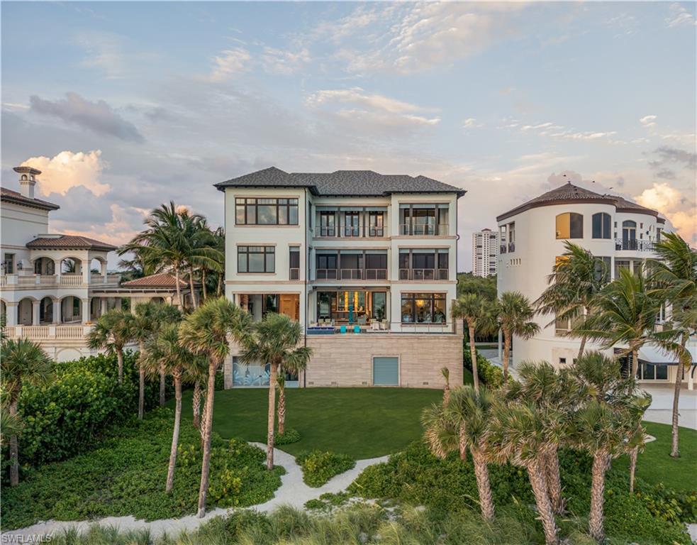 A stunning new home in The Strand at Bay Colony - one of Naples’ most exclusive beachfront communities. Designed by Stofft Cooney Architects and built by BCB Homes, this 5-bedroom, 5.5-bath custom residence blends contemporary coastal design with timeless craftsmanship. Light-filled open spaces feature wide-plank Legno Bastone floors, a 3-sided fireplace, and incredible natural finishes throughout. The gourmet kitchen includes high end appliances, Blue Roma quartzite counters, a full butler’s pantry, and a 400-bottle wine room. The top-floor primary suite offers sweeping Gulf views, dual closets, a spa bath, morning bar, and fitness studio. Outdoor living is a priority here with a resort-style pool, water feature wall, EVO grill, and reclaimed pecky cypress ceilings. It’s built to the highest standards with hurricane-rated windows & doors, generator, Control4 home automation, and private elevator. Wake up to the sound of the surf and walk straight onto the private sands of Bay Colony, or spend the day at the Beach and Tennis Club enjoying oceanfront dining and poolside relaxation. Behind you is 570 acres of untouched conservation land which offers a rare balance of nature and total privacy along Naples’ most coveted coastline.