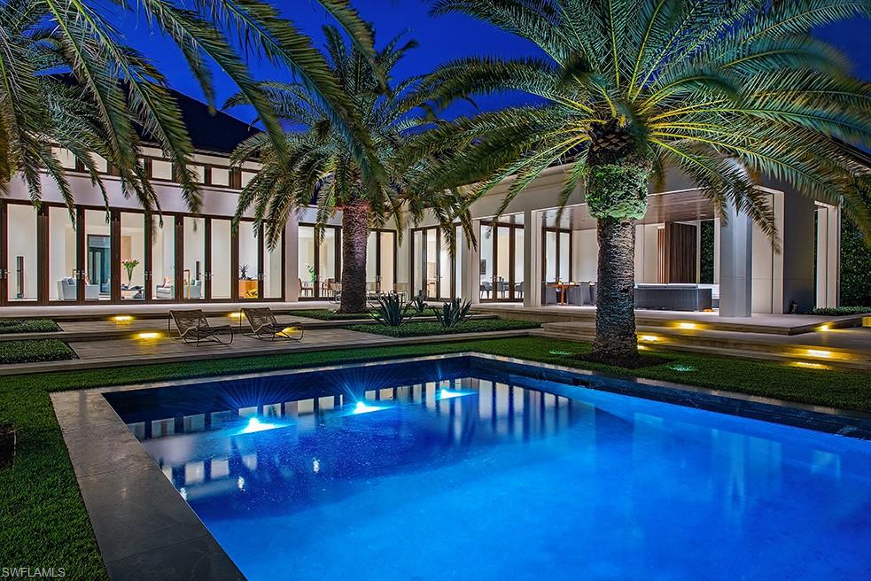 Welcome to The Sanctuary, a bespoke architectural masterpiece by Mark J. Leonardi, brought to life by A. Vernon Allen Builders. This nearly 8,600-square-foot waterfront estate showcases exceptional detail and craftsmanship, from its slate roof and copper gutters to natural stone accents and exquisite landscaping. Passing through the gates, reflection pools frame the forecourt, setting the tone for a serene experience. Inside, gentle light filters through vertical Tischler windows onto Portuguese limestone floors, illuminating curated interior vignettes. Designed as seven pavilions connected by glass-lined passageways, the home flows with discovery and intention. Floating walls eliminate the need for baseboards, enhancing a sense of weightlessness and architectural clarity. The layout weaves around private gardens, water features, and tranquil courtyards across a spacious lot and a half site. Each transition, from stone to glass, interior to exterior, is seamless and mindful. Clean lines, hidden storage, and a soft material palette create a calm, spa-like ambiance. Whether relaxing beside the palm-framed pool or walking the meditative halls, The Sanctuary is more than a home, it’s a retreat for the senses, designed to center, soothe, and restore. Eligible for immediate Port Royal Club membership to enjoy what will be the premier beach club in America.