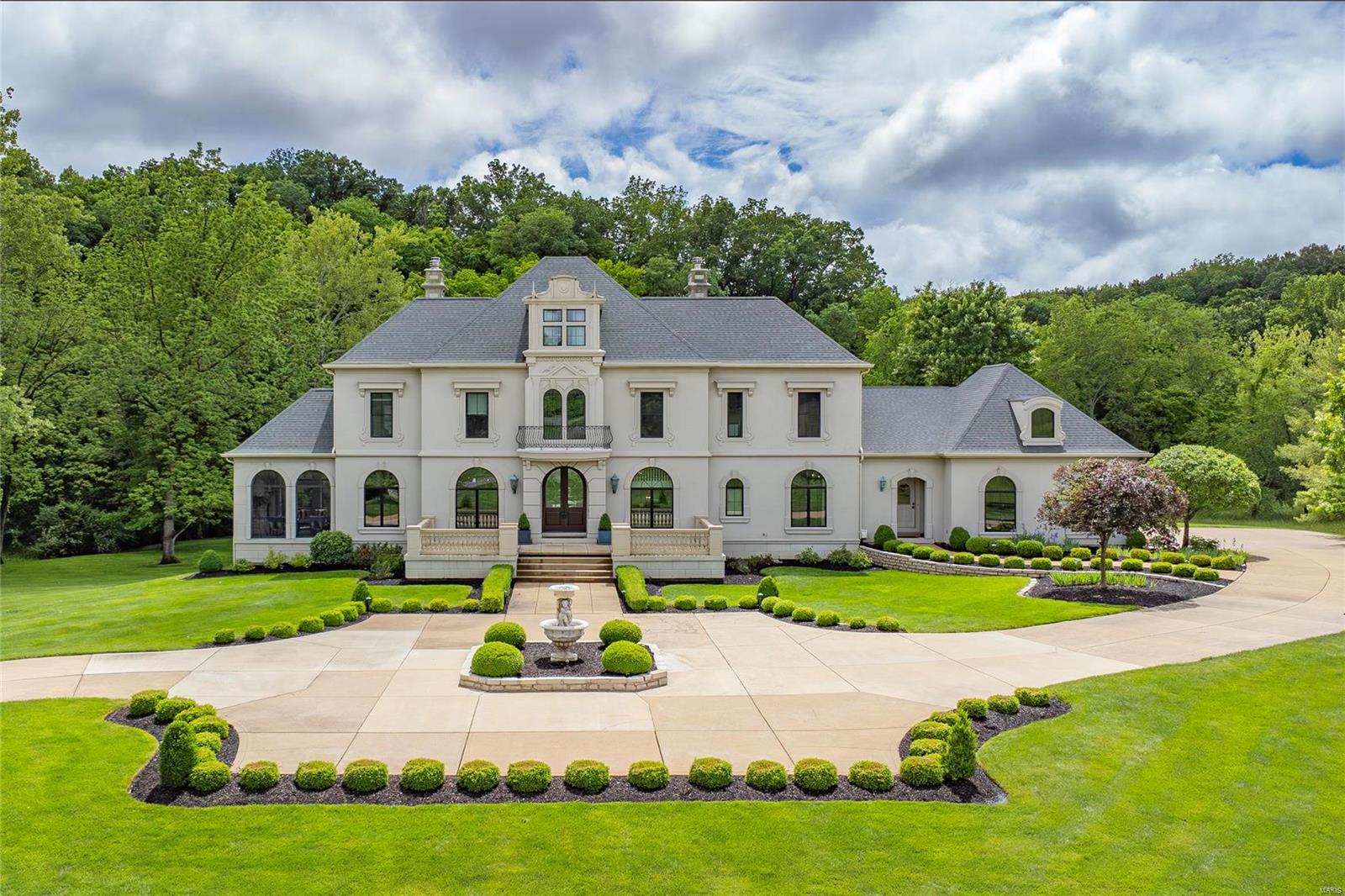 Exquisite, European-Inspired Estate, situated on a spectacular 1.68-acre lot. 5 Beds, 4.5 Baths with over 6,000 sqft of living space, has been extensively updated inside & out! Gorgeous open concept Kitchen with custom cabinets, leathered granite with 2” scroll edge, 10ft island/breakfast bar & walk-in pantry. Exceptional Master Retreat with deep coffered ceiling, dual spa-like Master Baths (2022), one with a designer soaking tub & shower, and the other with a steam shower - each with their own custom organized walk-in closets (2022)! Spectacular walkout Lower Level with large Rec Room including a mahogany wet bar. Highlights: new roof (2020), all new windows & exterior doors (2020), new zoned HVAC (new furnaces 2023 & AC units 2020), multi-zone irrigation systems, & oversized garage. Relax on the patio, in the charming gazebo or in the screened-in porch with gas fireplace & Blue stone floor, and enjoy richly landscaped, private estate with undisturbed views & preserved surroundings.