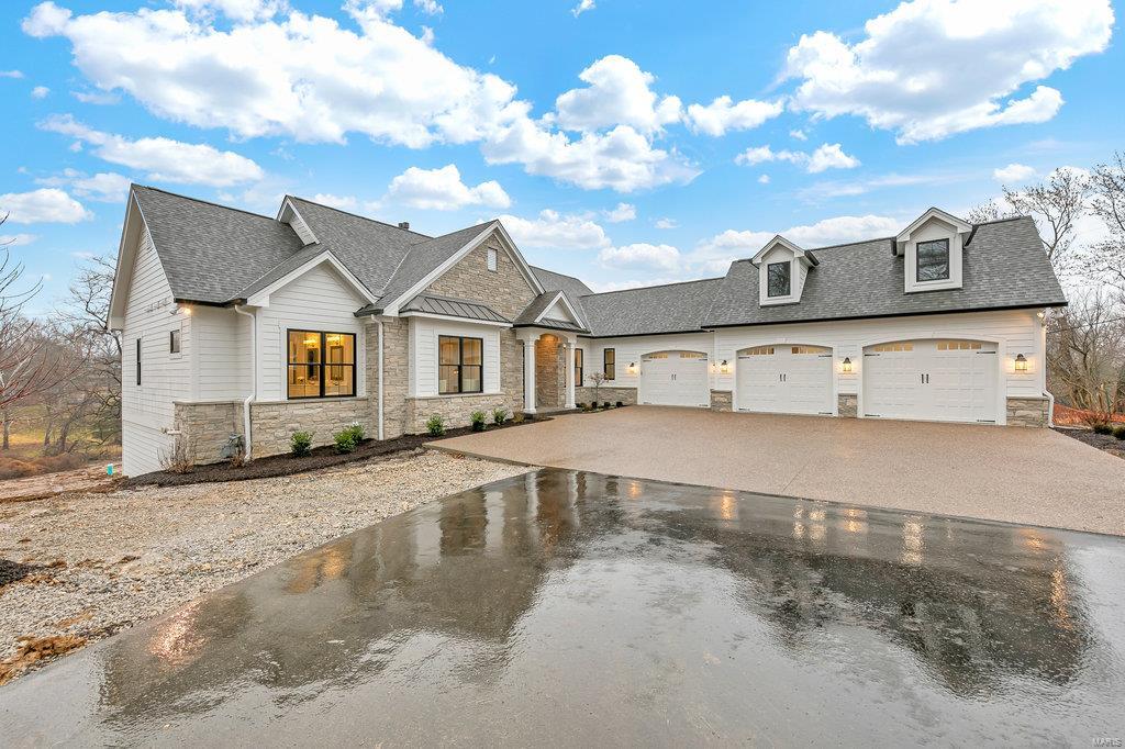 Set on a private .62 acre walk-out lot in Ladue Schools/Conway Elementary is this gorgeous Ranch style home by Dominion Homes. This home features dramatic ceilings from a 14' vaulted ceiling in the LR to coffered ceilings in the luxury master bedroom & trey ceilings in DR. Floor plan is amazing with a main floor master, energy efficient gas fireplace, open kitchen w/ a 48" range, pot filler, Quartz countertops & a 42" built-in refrigerator. Private master suite features an amazing bathrm w/ 2 large walk-in closets overlooking the private yard.3 private bedrms downstairs plus a family room flanked by a gas fireplace and a wet-bar.This home has high end designer finishes throughout. Other features include: walls of windows on the East side of the house, elegant light fixtures, large backyard big enough for an infinity pool, custom cabinetry, hardwood flrs on main flr, heated oversized 3 car garage, 2 beverage centers. Duplicate listing of mls# 21008071. Sod to be added prior to closing. Additional Rooms: Mud Room