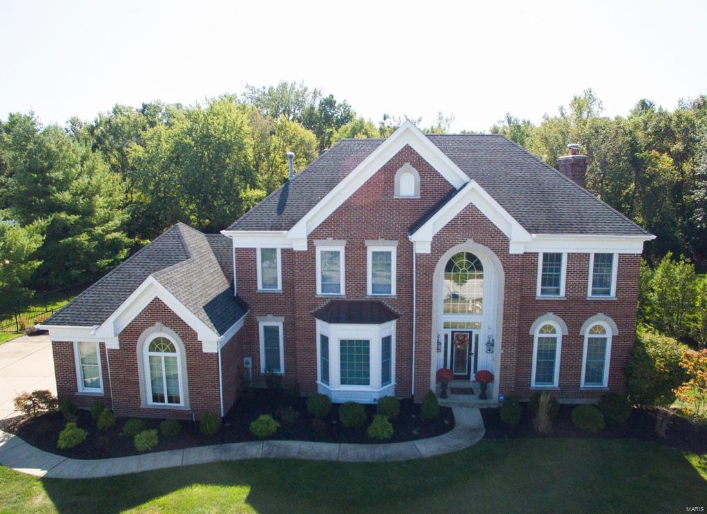 Exquisite 2Sty w/4 Bd/6 Bth (4F/2H) & 5700+/- sqft living space! 2-Sty Foyer flanked by Dining Rm w/crown molding & bay; Study/Den w/box beam ceiling, built-ins, sunburst windows, & recessed lights. Living Rm w/tons of windows, columns, FP, wet bar & patio access. Kitchen w/island, breakfast bar, Butler’s pantry, custom cabinetry, Quartz counters, backsplash, SS appliances & Breakfast Rm. Vaulted Hearth Rm w/FP. Main Floor Laundry/Mudroom w/cabinetry & utility sink; plus 2 Powder Rms! Front or back staircase leads to Master Retreat w/walk-in closet & luxurious Master Bth! Find 3 add’l Bds (1 en suite Bd & other 2 Bd share Jack & Jill Bth)! Highlights: newer roof ‘15, newer zoned HVAC w/humidifiers ‘17, hardwoods ‘18, moldings/millwork throughout, updated lighting, O/S 3-car garage w/newer doors ‘18, & landscaped yard, covered patio w/FP & outdoor grill, in-ground pool & fully fenced-in yard. Finished LL w/Family Rm, Rec Rm, Fitness Rm, 4th Bth & storage space!