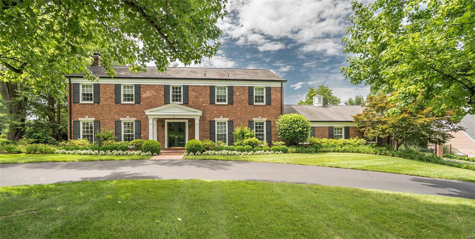 Set on a premier Ladue lane, this 2-story Traditional home has been renovated to live like new, but still maintain the original character. A graceful entry opens to a sun-filled living room with fireplace and dining room both with French doors that open to the terrace and pool area. The new Glen Aspaugh eat-in kitchen with high end appliances, white cabinets and granite counter tops adjoins the new mudroom, butlers pantry addition and family room with built in bookcases. The landing at the top of the stairs leads to a private master suite with luxurious marble bath and his/her closets. There are 3 additional bedrooms, an updated bath and 2nd laundry. The lower level has a large family room with a full updated bath that walks out to the terrace and pool area. Lovely moldings appointments throughout, hardwood floors on both floors, 2-car oversized garage, exceptional landscaping, sprinkler system, fenced yard with gate, and newer Pebble Tek heated pool with retractable cover. Additional Rooms: Mud Room