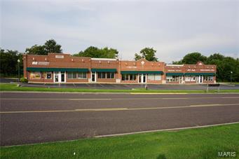 These two commercial buildings sit on a large 2 m/l acre lot and have over 17,000 m/l square feet of retail space!  The asphalt parking lot provides these 12 units with over 90 parking spaces.  They are located in a well established business community close to Walmart and receive great exposure.  This is a great investment property in a great location! Location: City