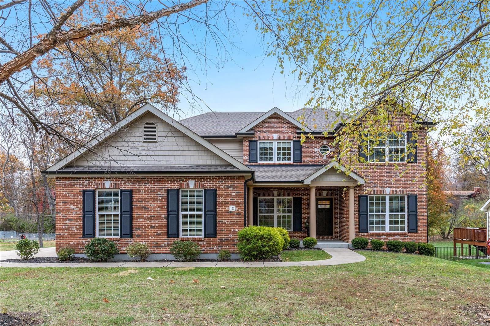 Custom-built brick 2 Sty in desirable Warson View with award-winning Ladue schools. Center hall floor plan features well-proportioned rooms with detailed trim work, 9’ ceilings & oak hardwoods that extend throughout the main floor. Impressive porch entrance highlighted by architectural columns leads to hardwood foyer, private study, formal dining room and spacious family room with granite fireplace & wide bay window. Designer kitchen with staggered cherry cabinetry, granite countertops, KitchenAid appliances, 5’ center island & butler’s pantry adjoins breakfast room with convenient planning center & sliding glass door that opens to deck. The 2nd floor extends the living quarters with a coffered primary bedroom suite with sitting area & luxury bath with jetted tub plus 3 additional bedrooms, 1 with ensuite bath, & hall full bath. Situated on a .54-acre cul-de-sac lot with deep level backyard, composite deck & 3-car garage. Stacy Park & Olivette Community Center are just minutes away.