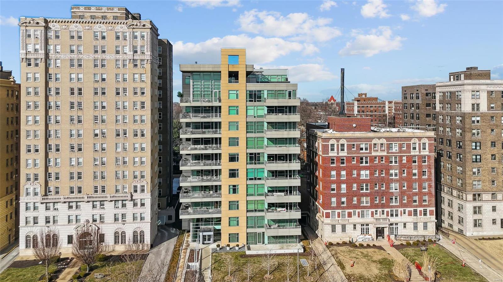 Elegant and refined condo with a covered, 300-SF terrace overlooking Lindell Blvd. and the Wash U Medical Campus. This is a dramatic Eero unit, with over 2,600 SF, a light and lovely open floor plan, 10-ft ceilings, panoramic floor to ceiling windows, and direct elevator access to a private elevator foyer. Other features include Mirage wood floors, built-in bookcases, a walk-in pantry adjoining the  kitchen, closet organizers, designer electric shades, plus an in-unit washer/dryer. The high-quality finishes and upgrades in this unit are amazing, with top-of-the-line baths and kitchen. The first floor of 4545 includes a lobby with attendant, fitness center, guest suite for overnight visitors, plus a reception/conference room with wet bar, kitchen and outdoor patio. There are 2 parking spaces (#14 and #55) in the attached heated garage, plus a storage locker in the garage. Enjoy walking just 1/2 block to Euclid Avenue's fabulous cafes, shops and restaurants! Forest Park is 2 blocks west! Location: City