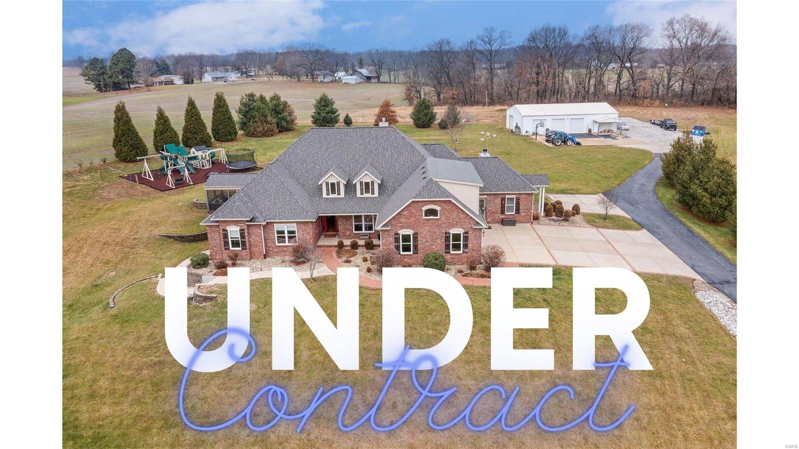Amazing private estate in Triad school district is a vacation paradise! Situated on over 12 acres, this expansive home features 6 bedrooms & 6 bathrooms w/ 6837 sq. feet of living space. Totally renovated & move-in ready! Ask your agent for list of updates. Outdoor space was designed for entertaining w/ oversized custom saltwater pool, basketball court, covered patio, & many seating areas. Huge outbuilding w/ oversized garage doors. Gorgeous kitchen features large island w/ seating, walk-in pantry, large Thermador Range, premium stainless appliances & honed granite countertops. Cozy hearth room off kitchen features beautiful fireplace. Private master suite w/screened-in porch is the perfect place for morning coffee. Updated spa-like master bath w/ walk-in tile shower & large corner tub. Office w/ separate entrance for private access. Bedroom loft upstairs with large bath. Finished walk-out basement features large space for entertaining, 2 beds & full bath. Amazing storage! Agent owned.