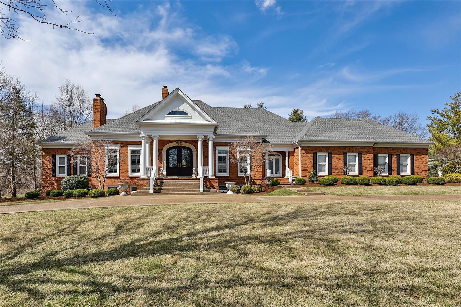Extraordinary Johnson built residence on over an acre located on a private quiet cul de sac. Impressive grand entry w/custom made dark mahogany double doors & marble floors.Arched columns lead to gracious LR which boasts crown moulding, cove ceiling,arched built in bookcases, fireplace & French doors to brick veranda.Elegant DR offers a full wall wine cooler, plantation shutters, & wood floors.Office has floor to ceiling windows, fireplace & built-in bookcases. Exquisite main floor primary bedroom is a true retreat. Gourmet kitchen opens to light filled breakfast room & butler's pantry w/a wine refrigerator plus bar. Dramatic hearth room has vaulted ceilings, fireplace & built in arched bookcases. A sweeping staircase to entertainment area also includes FR, game room & media area, plus a bar. There are 3 guest quarters & an office. French doors to patio area.3 car oversized garage.Sophisticated décor is evident throughout & is perfect for all your entertaining needs!