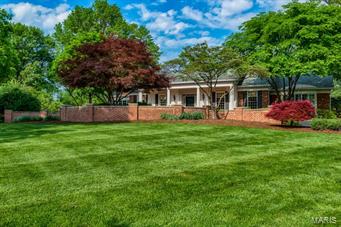 Serene and tranquil best describes this beautiful home situated on one of the most sought after lanes in Ladue. Extensively remodeled  over the past few years, this home features stunning new kitchen and butlers pantry with the very best  in finishes.  The pool area is spectacular with lovely bluestone patio and lush  gardens on 1.8 manicured acres.  Pool  and patio area was completely renovated in 2014. Also newer is the wonderful lower level with custom theater, large entertaining area and full bath. This gorgeous home is large and sprawling with bright open rooms throughout. Other updates include warm and inviting library surrounded by bookcases and a fireplace, new architectural roof(2014) and  so much more.  Lovely and warm throughout.