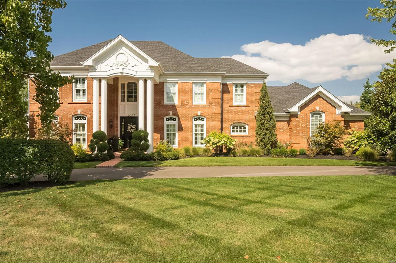 Exceptional craftmanship & distinctive design elements define this sophisticated 2-sty Georgian Colonial. Classic center hall floor plan features well-proportioned rooms with oak hardwoods, detailed trim work & plantation shutters. Impressive entry foyer leads to elegant dining room, formal living room/study and spectacular great room with wide bay window, wet bar & marble fireplace. Designer kitchen with 48” glazed white cabinetry, granite countertops, stainless steel appliances & 7’ center island adjoins breakfast room with butler’s pantry & groin vaulted sunroom. Coffered primary bedroom suite with luxury bath with freestanding tub plus 3 additional bedrooms, 1 with ensuite bath & 2 with Jack n’ Jill bath, complete the 2nd floor living quarters. Lower Level entertainment space includes recreation room, family room with stacked stone fireplace, game room with wet bar, 5th bedroom & full bath. Atrium door opens to outdoor living area with patio & pool surrounded by landscaped gardens. Additional Rooms: Sun Room