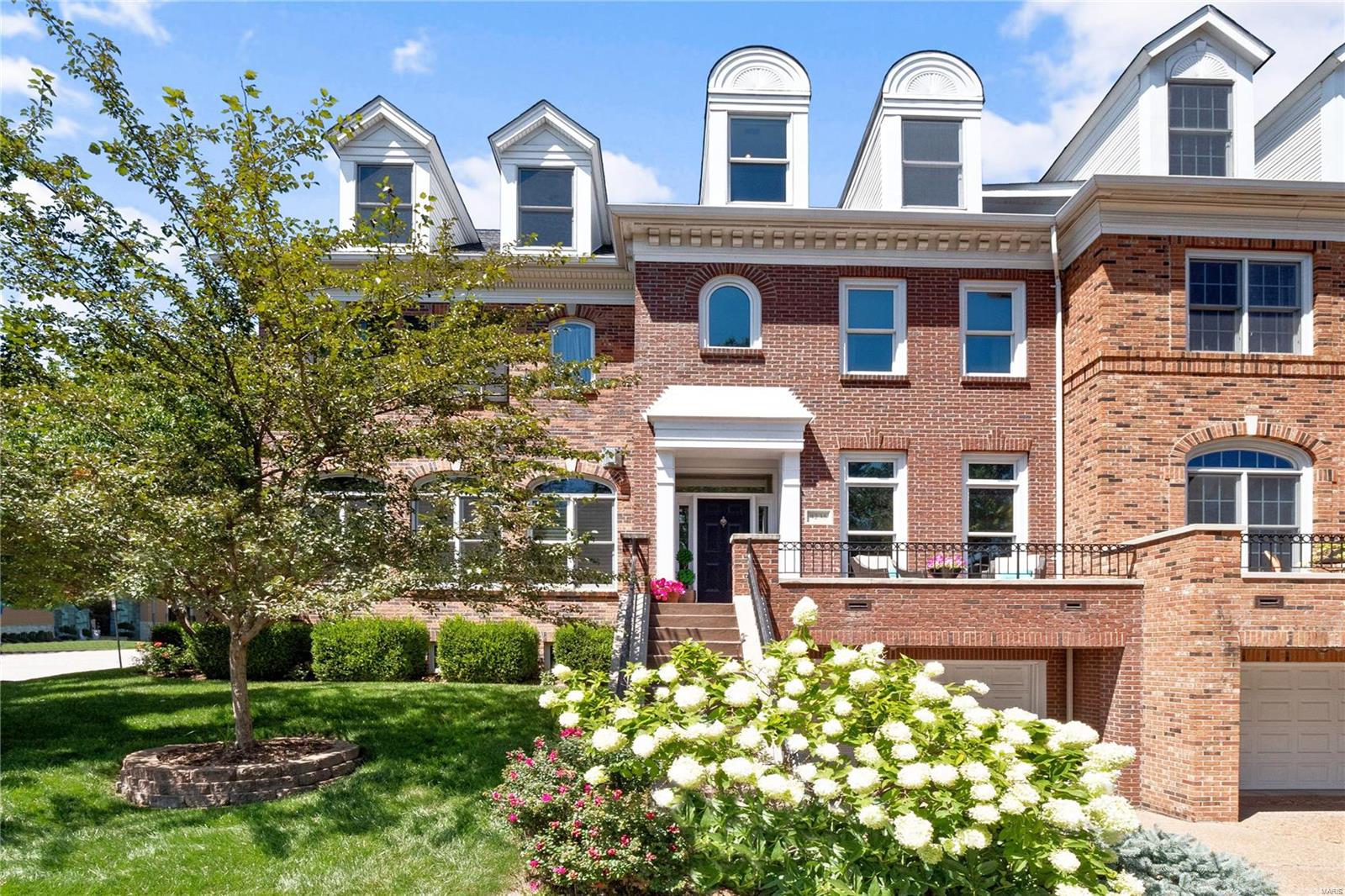 Chic & sophisticated 3 story townhouse with enormous, state-of-the-art kitchen created with the finest contemporary design & artistry. Wonderful charcoal grey stacked brick fireplace is flanked by custom built-ins. French doors open to the deck. Custom cabinetry built by St. Louis Woodworking, feature high style lacquer finish & chrome accents.Marble slabs hand selected for all counters.  SS appl. include gas range & range hood. 2nd flr features luxurious master suite with his/hers bathrooms & walk-in closets. Also guest suite & laundry room. The third floor has a large open family room/game room, spacious 3rd bedroom or office & full bath. The lower level has 2 car tuck-under garage & large room ready for your finish. Best of all is your personal elevator!! No Fees.  Enjoy the Clayton lifestyle you've been dreaming of in this wonderful home overlooking beautiful Shaw Park with Straub's Market, fine dining & casual cafés just steps away. Showings begin 8/28 after noon, Open Sunday 1-3