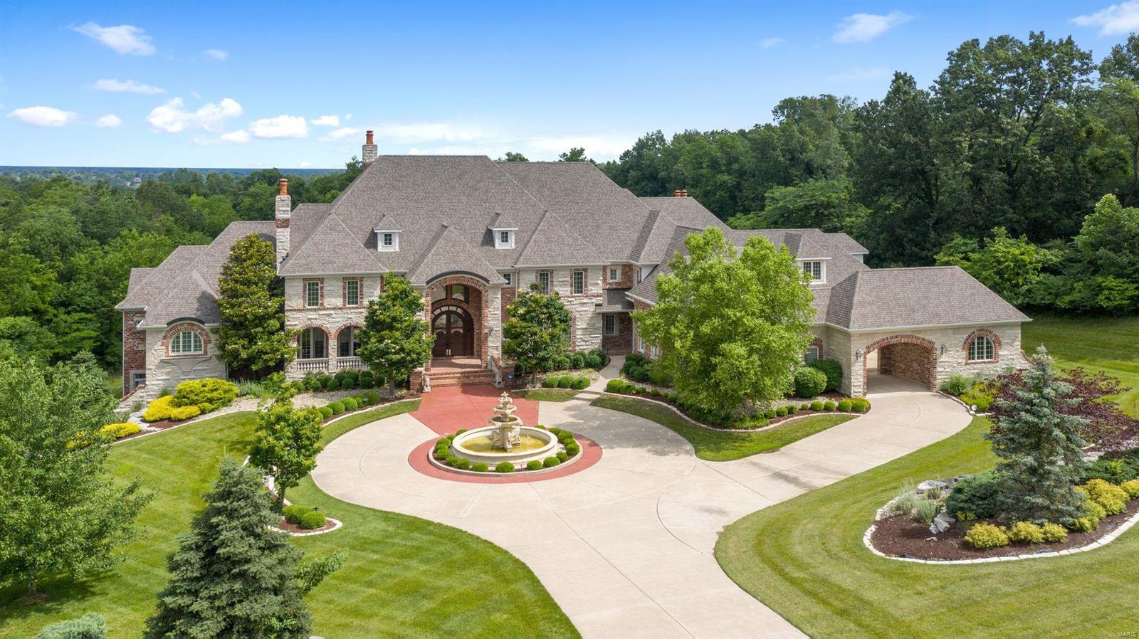 Stunning and sophisticated, the magnificent 2-story home offers unrivaled craftsmanship, distinctive design and is being sold with furnishings.  An impressive sense of arrival greets you in the marble reception hall with an elegant sweeping staircase and a handsome library.  Inspiring views of the beautifully composed grounds and golf course are framed by the great room's stately columns, 25 foot ceilings & expansive windows. An opulent kitchen offers two large islands, state-of-the-art appliances, a windowed breakfast room and a generous butler's pantry, all of which open to a warm  hearth room. World class amenities include a wine cellar with built-in humidor, a health spa with gym, sauna, steam and tanning rooms, billiards room, stadium seating theatre, generous wet bars, golf simulator, elevator and a 6-car garage. Open and covered terraces, an outdoor kitchen Lanai, formal gardens and a saltwater pool nestle on 3.31 secluded and lush acres with serene golf course views. Additional Rooms: Mud Room, Wine Cellar