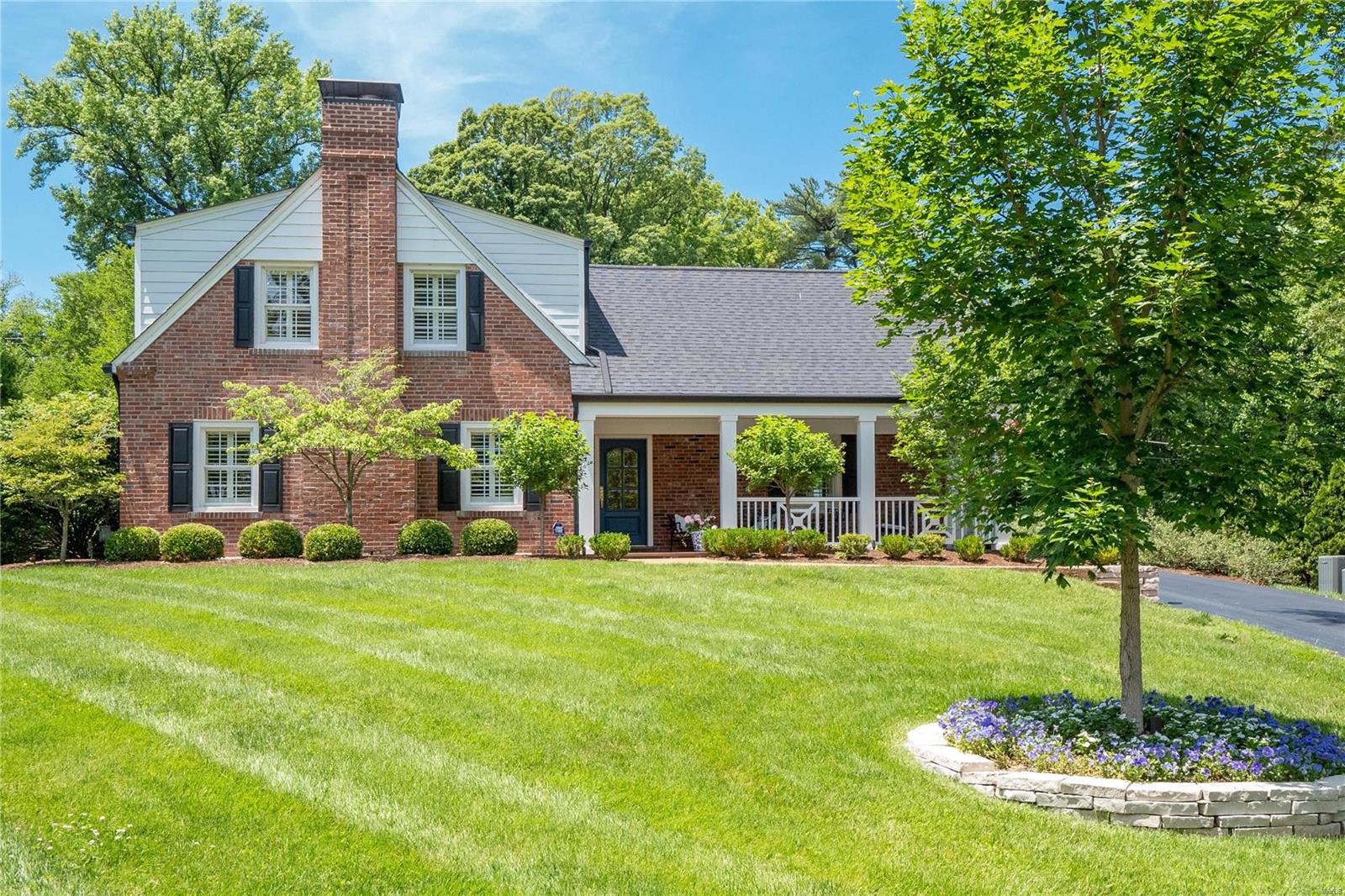 This updated 4 bed/3 bath gem in Willow Hill seamlessly blends classic elegance with every modern luxury you need. The professionally landscaped yard and covered front porch set the tone for elegance and comfort that awaits within. As you enter, find a formal living room with a gas fireplace and a light and bright formal dining room. Move to the hearth room, where you discover floor-to-ceiling windows, another gas fireplace flanked with built-ins, and multiple French doors leading to the patio and yard. The fresh, white kitchen offers newer appliances/sink and granite counters. Another room converted into the laundry and mudroom completes the first floor. Upstairs, find four bedrooms and two completely renovated bathrooms. The lower level offers a spacious rec room and ample storage. Take advantage of the refreshed 3-car attached garage, relax on the patio, and enjoy the large backyard. Located in the heart of Ladue, you are close to all highways, downtown Clayton and airport. Additional Rooms: Mud Room