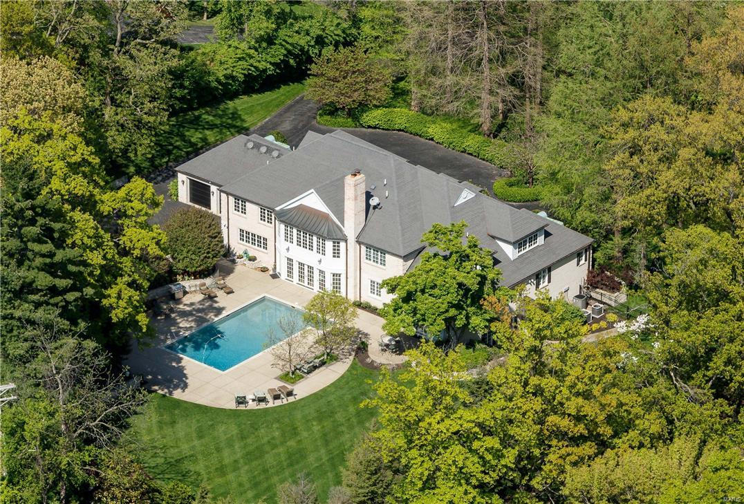 Stellar Clayton location, World-Class setting & Price.(Click MovieReel Icon or VirtualTour for Video of manicured, private 1.3 acres, grounds & expansive play yard). 8000SF; refined finishes. Literally steps to Starbucks. Grab coffee, walk or bike down Wydown Blvd. (called "One of America's most beautiful streets"), to Forest Park, (rated #1 Nationally of all City Parks by CBS; museums, golf, The Boat House, Steinberg Ice Rink.) Libations @ sunset at Bar Les Freres or Fine Dining at I Fratellini, both walking distance. $3.0 Million invested in this home. No better floorplan in Brentmoor Park/ Carrswold. Main Level: Kitchen looks directly out to pool/terraces/patios & opens to 2-story Great Room. 1st floor Master w/adjacent office. 2nd Level: A way cool hangout area is hub, w/a BR @each corner, each w/own bath. Walkout/Finished Lower Level: WineRoom, MediaRoom, Exercise Room. 5BR/6BA. Selected by KMOV TV-4, "Greatest Luxury Homes of Saint Louis" Seller ready now to move on! Make offer!