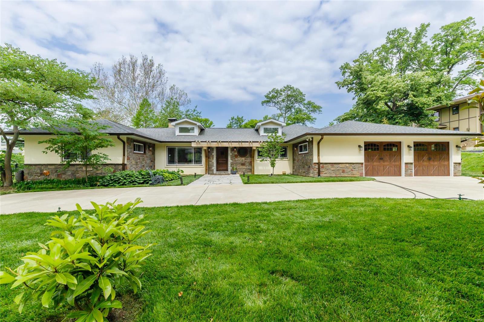 Renovated home in the prestigious Ladue School District.  The unique floorplan has a separated bedroom design with the MBR suite, sitting room/office, & casual sun room overlooking the large inground pool, patio, and picturesque screened patio.  The kitchen is a chef’s delight with upgraded GE Monogram appliances, Cambria counters, 2 DWs, prep sink, double oven,walk-in pantry.  The south wing was recently updated with built-in armoires, 2 full baths (one ensuite and one jack-&-jill), and a conveniently located MFL.  More fun features include the cathedral ceilings, 10 skylights, refurbished barnwood floors, 3 fireplaces, huge breakfast bar, & demand water heater.  The basement has french doors & a full bank of windows that bring light & life to the stunning rec/family room with a ½ bath.   Lastly, the tandem garage holds 4 cars, has extra storage and a mower service door, which is useful on this .92 acre lot.  Great location in the heart of Olivette on a private road. Additional Rooms: Sun Room