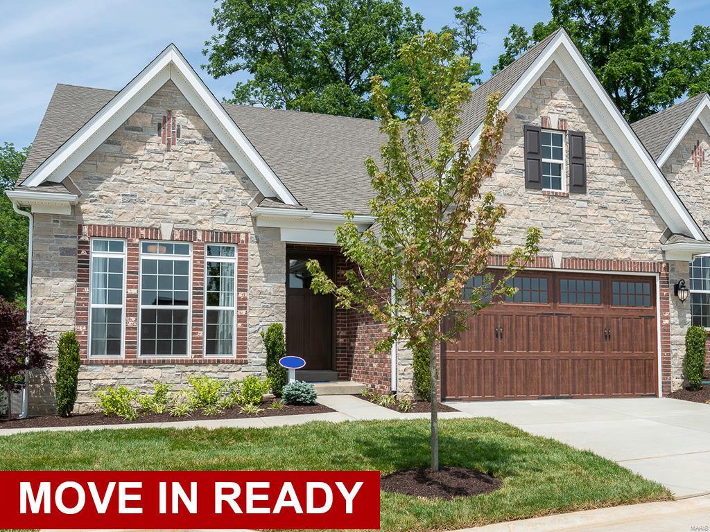 Display home for sale - Move In Ready NOW! Luxurious, low maintenance lifestyle in the heart of Frontenac. 4BR, 4.5BA villa! Finished lower level with expanded rec room, wet bar, flex space, and bedroom and bath. Beautiful hardwood flooring. Foyer opens to large flex space for formal dining room or study area. Open floorplan with 9FT ceilings and two story great room, with a gas log fireplace with stone face. Incredible kitchen features large island, level 7 white cabinetry with glass stacked cabinets, white tile backsplash, Cambria quartz countertops, and stainless steel GE Monogram series appliances. The main floor master suite includes dual walk-in closets and master bath with double sink vanity, large tub, and walk in shower with seat. Upstairs are 2 additional bedrooms, each with private bath and walk in closet, and a large loft. GE washer and dryer included. Composite back deck with aluminum spindles. Also enjoy peace of mind with McBride Homes' 10 year builders warranty!