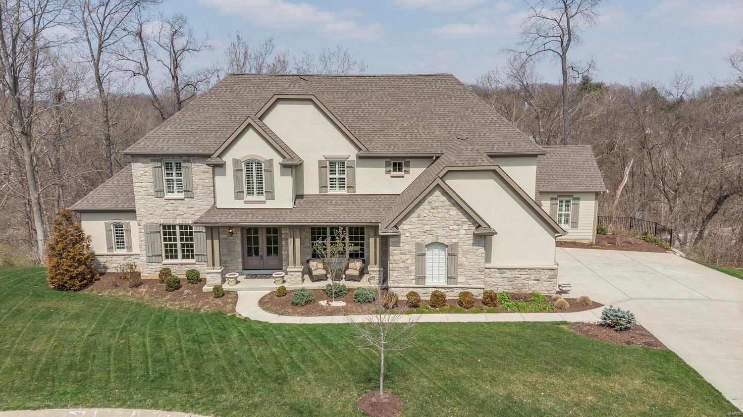 Attention to detail throughout! 1.5 story Flower built home on a private, fenced in, cul-de-sac lot. As you enter, the charming foyer opens to a large dining rm w/ arched openings. The living rm/study has wood floors & arched openings. The 2 story great rm w/ stone fireplace, built-ins, & vaulted beamed ceiling, opens to the breakfast rm & gourmet kitchen w/ granite countertops, custom backsplash, center island, 6 burner dual fuel range w/ 2 ovens, planning desk, & butler's pantry. ML  master has a gorgeous luxury bath w/ his & hers vanities & 2 WICs. ML also has a 2nd bedrm w/ ensuite. Loft/family rm on UL w/ 3 addtl bedrms each w/ its own separate ensuite. Finished, w/o, LL w/ rec rm, game rm, walk behind wet bar, 1/2 bath, & massive unfinished area plumbed for an addtl full bath & ready for an addtl bedrm. Addtl features include ML laundry, deck, brick paver patio, 3 car side entry garage, & more. This exquisite home, along w/ its convenient location, make this an absolute must see!