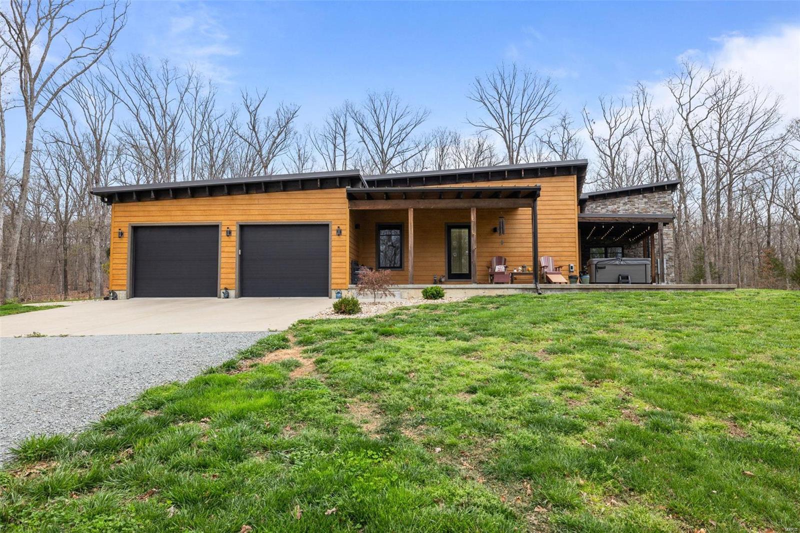 Stunning, custom home on 20 acres in Winchester Hills! This home is a perfect, peaceful retreat in Farmington School District! The great room boasts a floor to ceiling stone fireplace, exposed beams and lots of large windows to take in the beautiful, scenic views! The kitchen is one dreams are made of including custom cabinetry, walk-in pantry and granite counter tops! The large master suite has electric fireplace, huge walk in closet with custom cabinets, and master bath has his and her vanities and large custom stone shower. The other bedrooms are all great in size and have large closets! On the main floor you will also find an office, mudroom and large laundry room with custom cabinets! The basement has a family/rec room, wet bar area, half bath, and second master! Outside you will find 2 covered patios and a large shop. The shop has an apartment/bunk house, half bath and still plenty of room for all the toys! 

Come see it today!