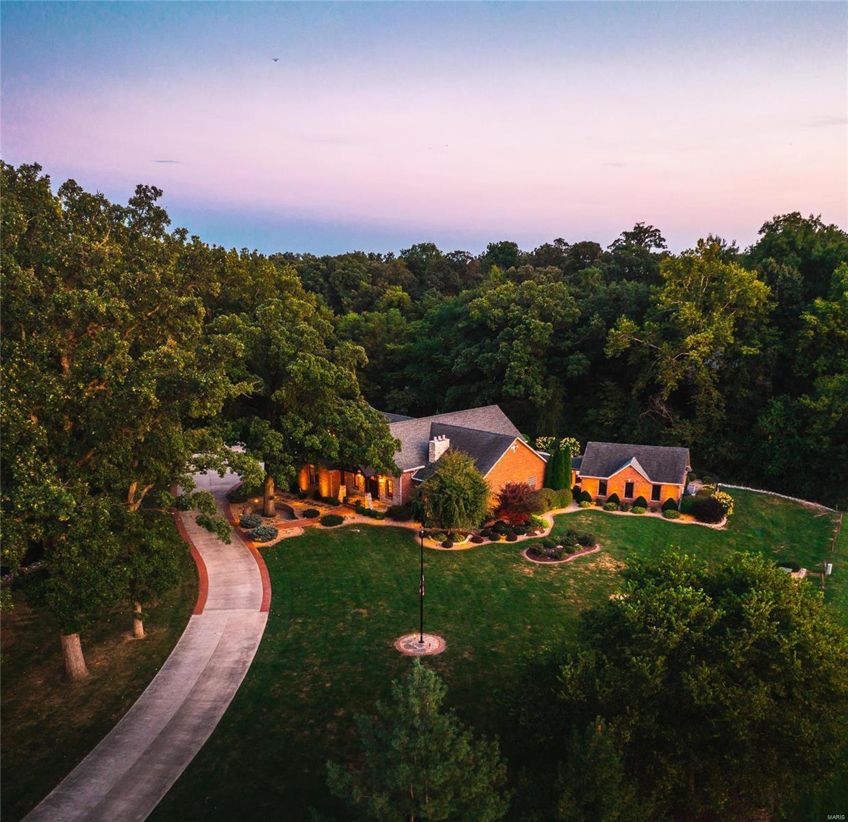 Masterful design and modern luxury are uniquely embodied in this 5 bed/4 bath residence that invites comfort aplenty. The gated entry home is positioned on 6+ acres and features nearly 6000 SF of living space. Magnificent resort-like views consume the main and lower levels of this meticulous residence. A seamless flow is created from the vast kitchen, dining and living areas to the expansive outdoor pool, full kitchen/bar and pool house. Special highlights include the split bedroom floor plan, master bedroom suite includes dual sided fireplace. Two additional bedrooms with private baths, main level office, laundry and half bath. The bar, family room, gym, and 2 bedrooms and bonus room are all located on the lower level. A 3 car garage includes entry to the basement, heated floors and opens to the back yard/pool. Many high end features including audio tower, generator, partial heated driveway, security and irrigation system. Don't miss your opportunity for upscale living at its finest!