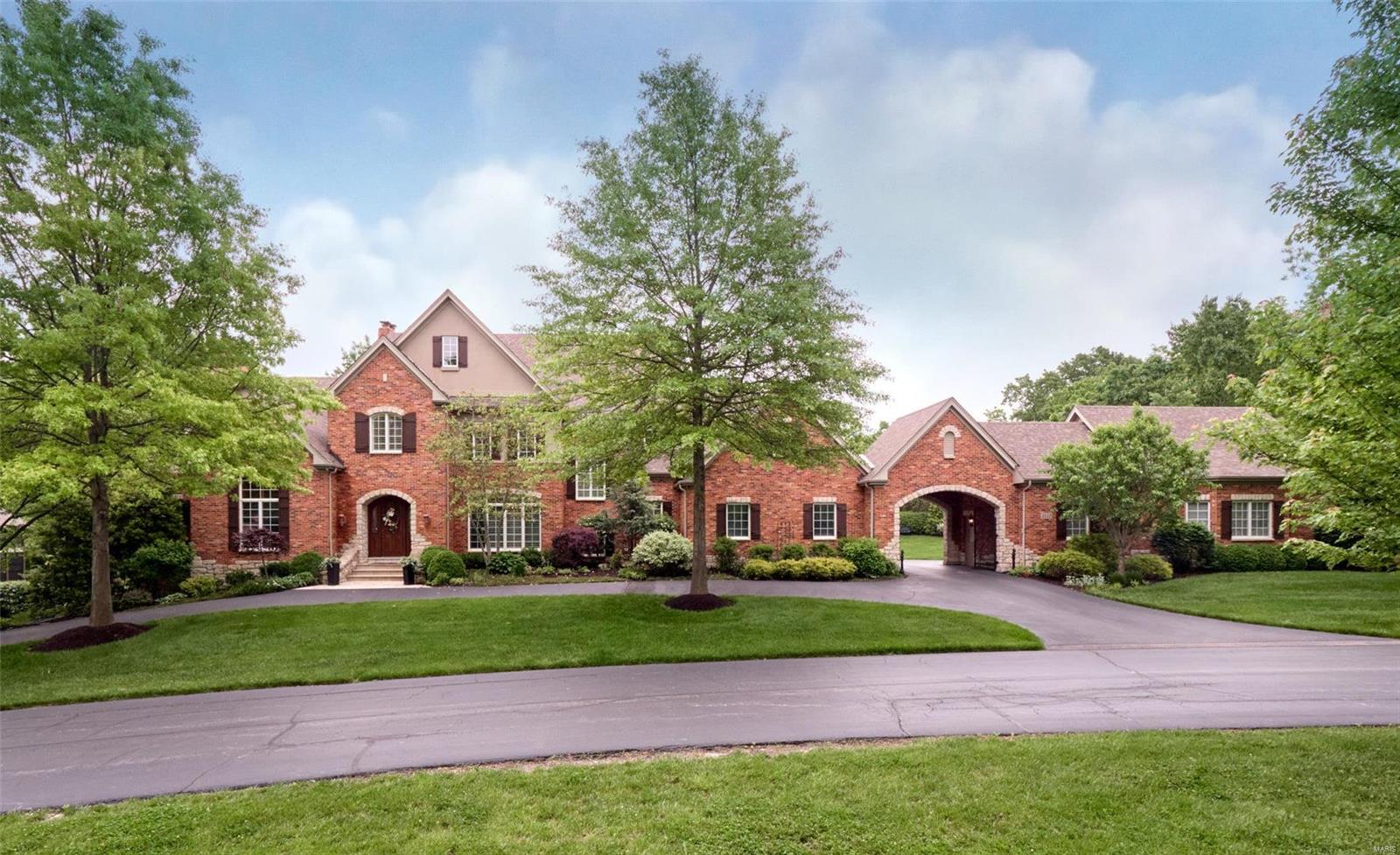 LUXURY YET COMFORTABLE LIVING AT HOME WITH OVERSIZED IN-HOME GYM, GORGEOUS SALTWATER POOL SURROUNDED BY PRIVATE LUSH GROUNDS AND FIVE CAR GARAGES.! FULLY FENCED AND GATED! Over 6921 Sq Ft With 7 Beds and 7 Baths Total. Gracious 2sty Foyer and 2sty Great Room With Gorgeous Wall of Windows. Incredible Woodwork Flanks the Office With Full Wainscot and Beamed Ceiling Plus Oversized Baseboards, Crown Moldings and Custom Shelving and Alcoves. Hardwood Flooring on First/Second Floors Plus Most of Fin Basement. Very Inviting Kitchen Opens to Vaulted Hearth Room With Views From Every Window, Gas Cooktop, Spacious Island and Plenty of Serving Area. Front and Rear Staircases With Upgraded Runners, Plantation Shutters, Four Fireplaces, Walk Behind Bar, Upgraded Lighting. Enjoy Your Master Suite Which Walks Out To Private Deck and Large Master Bath With Separate Vanities, Separate Closets, Oversized Shower and Oval Tub. Additional Rooms: Mud Room