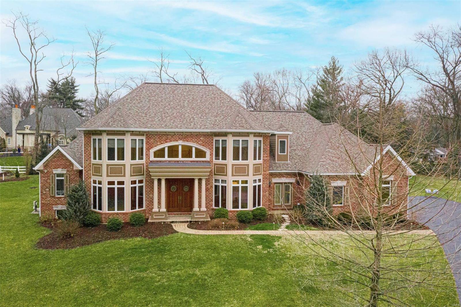 This 12-year young home sits on a quiet cul-de-sac of just three exclusive homes in a highly sought-after neighborhood. The exceptional quality of finish and construction is apparent from the moment you enter into the 20' tall foyer. No expense was spared with over-sized trim & moldings, 10' - 11'6" tray & box-beam ceilings, and Cherry lined office. The gracious living room opens to a serene solarium overlooking the pool, patio, and gardens. Chef's kitchen with full-size Sub-Zero refrigerator & freezer, Wolf range,  enter island with prep sink, and walk-in pantry. The adjacent family room features a gas fireplace with stone surround. 1st-floor Primary Suite has a generous bathroom and dual walk-in closets. Three 2nd-floor bedrooms, all with en-suite baths and walk-in closets. The expansive deep-pour basement is ready for your customization. .86ac lot with plenty of flat space to run and play. A 3-car garage and 1st-floor laundry/mudroom complete this outstanding offering. Additional Rooms: Mud Room