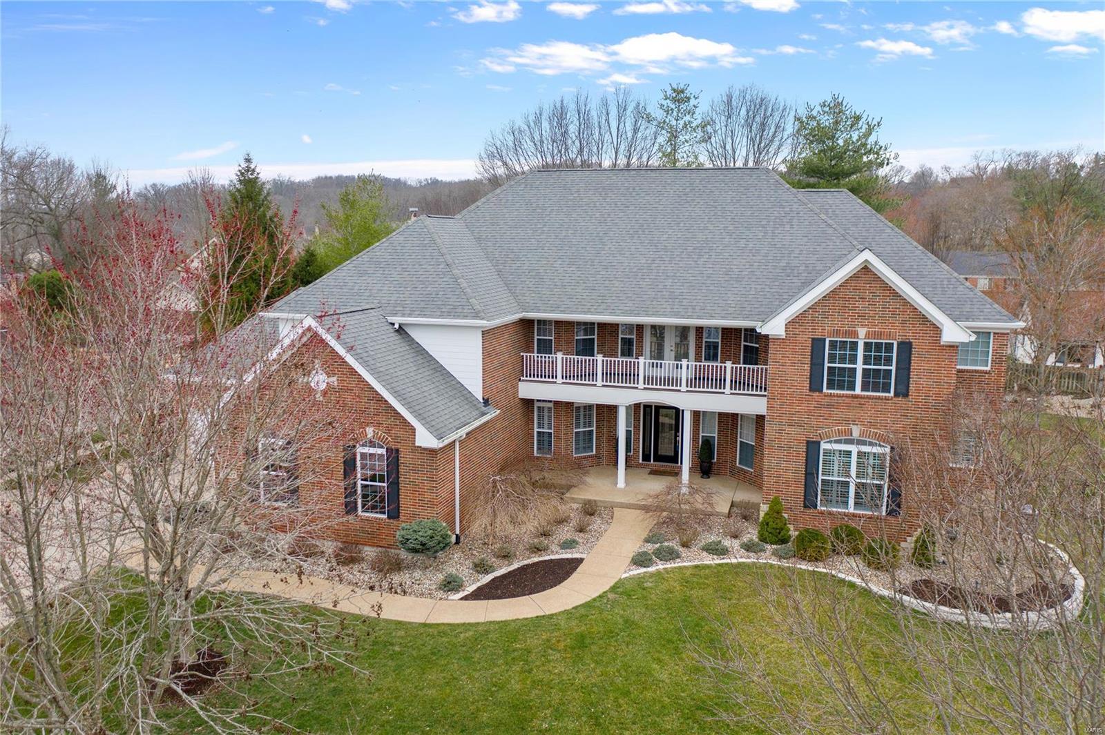 Stunning 1.5 story home with five (possible 6) bedrooms, 4.5 baths and over 6600 finished sf. Heated inground pool and a 4-car garage! Impressive two-story great room. Updated kitchen offers custom 42-inch cabinets, granite counters, center island/breakfast bar & SS appliances. Hearth room with stone fireplace opens to screened porch overlooking the lush yard. Main floor master features cozy fireplace, private access to screened porch, large walk-in closet and fantastic bath with oversized walk-in shower w/ dual showerheads & soaking tub. Upper level offers four spacious bedrooms sharing two, updated Jack-n-Jill bathrooms and a great bonus area with access to exterior balcony. Finished walk-out lower level offers large rec room, wetbar, full bath and potential for two addl bedrooms. Built-in sound system on main & upper levels. The beautifully landscaped, fenced yard features stone patio with TV, outdoor audio system and heated, inground pool with cool-decking surround.