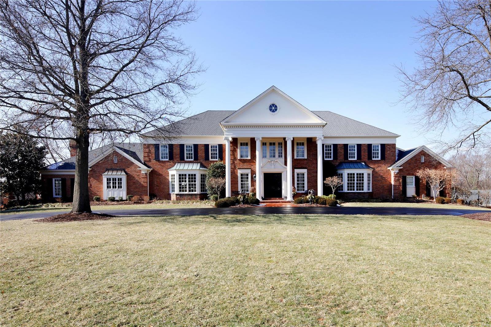 7 Carters Grove has been painstakingly renovated and updated to offer the finest finishes one would expect from an estate of this caliber.  3 acres of lush privacy surround this stately home that offers 7 bedrms, 6 full and 3 half baths. Every inch has been touched both inside and out!   Built for both family and entertaining, the open kitchen,  breakfast rm and hearth rm is perfect for cozy nights in while the formal dining rm, living rm and great rm flow seamlessly together and out to the terraces and great outdoor spaces through a wall of French doors.  The main flr master is privately situated with new luxury bath; or choose the 2nd flr master also with new luxury bath. The outdoor spaces showcase an updated pool, pool house, outdoor patio with fireplace and fire features.  Since purchasing the property, the owners have invested over $2.5m in renovations. It is perfection at every turn! All this and 2 garages that can house 9 cars!  Located in heart of Ladue close to Old Warson CC. Additional Rooms: Mud Room