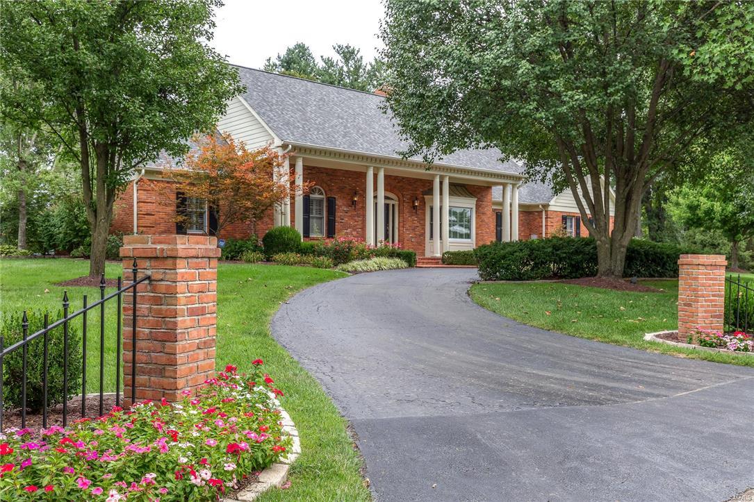 Stunning home on an exceptional acre lot in Town and Country! Understated classic taste is exemplified throughout this meticulously maintained &renovated home. 5 beds & 5 full/2half baths w/ a Master suite & 2nd bed on main floor.  Rich espresso wide plank hardwood flooring is throughout main floor.  Exceptional kitchen w/ crisp white custom cabinets, gorgeous granite tops, oversized center island & Thermador appliances w/ warming drawer & wine cooler complete this gourmet kitchen! A tranquil sunroom has wall of glass opening to  back terrace w/  oversized pool & area for entertaining.  Tall beamed ceiling & marble surround fireplace define the spectacular Great Rm. Main floor has a living rm which opens to the dining rm, main floor laundry & mud rm w/  4 car garage.  Every inch of this home has been redone w/ highest level of workmanship! Upstairs offers 3 beds, 2 bonus rms w/ skylights-perfect for office/ playroom, plus 2 new full baths. LL family room & half bath are ready to enjoy!