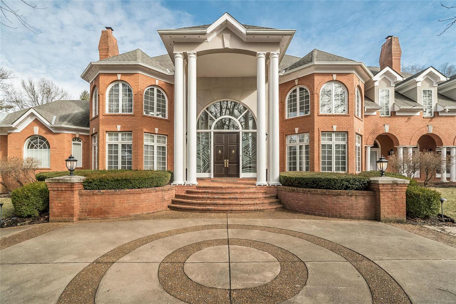 One of a kind property is situated on a private street. This is a stunning 1.5 story with 5bed & 7bath, has approx 1.59 acres and 9518 sqft. Incredible details throughout include the stately grand entrance w/circular custom driveway.Grand Foyer leads to Dining Rm;sunlit Liviing rm with fireplace. Great Room with window wall and fireplace. Gorgeous Breakfast Rm which leads to gourmet Kitchen w/huge breakfast bar/island, custom davinets, grainte & high-end appliances, food warmers, double sink & Hearth Rm w/fireplace. Master Suite with Sitting Room, walk-in closets & spectacular master bath w/jetted tub, separate shower & double vanity. Convenient 1st floor laundry & 2 Powder Rooms. Incredible staircase leads to 2nd floor w/balcony, 4 bedrooms (each w/full bath) & Bonus Rm. Walk-out Lower Level-ready to be finished! Features: Tray/vaulted ceilings, hardwood flrs,central vac, intercom,alarm, inground sprinkler, 5 zoned HVAC. Oversized 4 car side-entry garage.