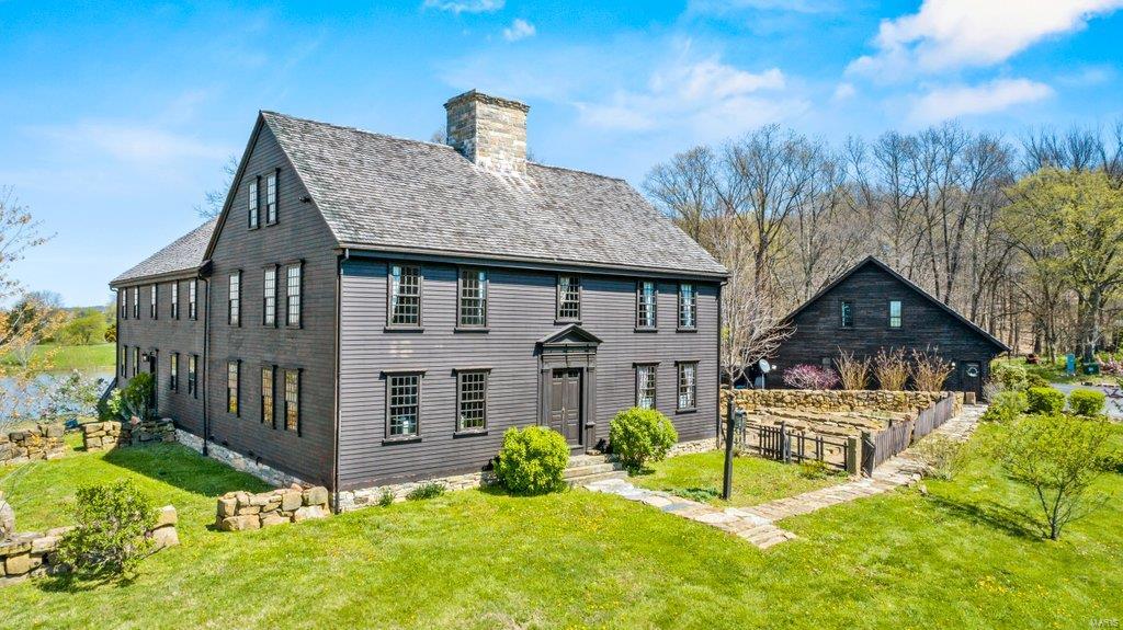 PRICE REDUCTION on this beautiful historical colonial home with over 9000sqft of finished living space. Priced below previous appraisal, this is an opportunity for instant equity. This 5br/5ba home, was the dwelling of Captain John Parke and was brought to this location, brick by brick from New England and reconstructed with precise detail where it now sits on a 10+/- acre estate over-looking its own private lake. Land has no covenants or restrictions on it, so potential for many possibilities. This property has a sprawling flag stone patio, outdoor fireplace, in-ground pool, carriage house, 7 fireplaces, wrought iron door fixtures and a fully finished basement.   It's the perfect mix of 17th century, with the convenience of the 21st century.  Want to own a piece of American history, here is your chance. Additional Rooms: Sun Room