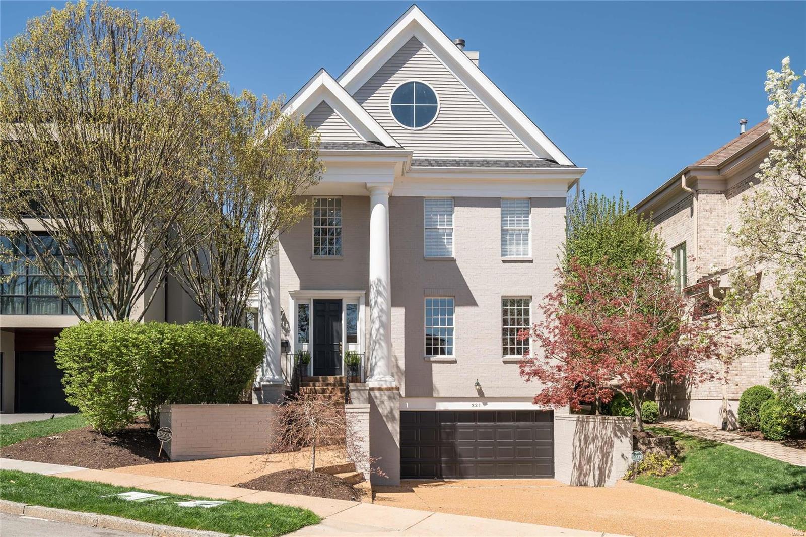 Premier Clayton location, style & condition. This quintessential Clayton townhome has it all. Walk to restaurants, Taylor park & shopping.  Elegant painted brick home is grand in stature.  1st floor features wide plank espresso woods floors & soaring ceiling heights! Recent updates include Master Bath, Roof, HVAC & New Driveway.  The front den provides the privacy needed to work from home or find a secluded place to sit & read. The dining room is centrally located off the foyer. Hearth room has soaring ceilings, fireplace, book cases & flows graciously to the kitchen.  The kitchen has a contemporary, sleek look, breakfast nook & flows to the patio overlooking the private, well manicured yard.  The opulent 1st floor master bedroom has updated master bathroom, his/her closets & patio access.  2nd floor with large landing overlooking the foyer, 4 large bedrooms & 2 nicely appointed baths.  Lower level with three car garage, storage area, exercise room, family room, 1/2 bath & wine closet.