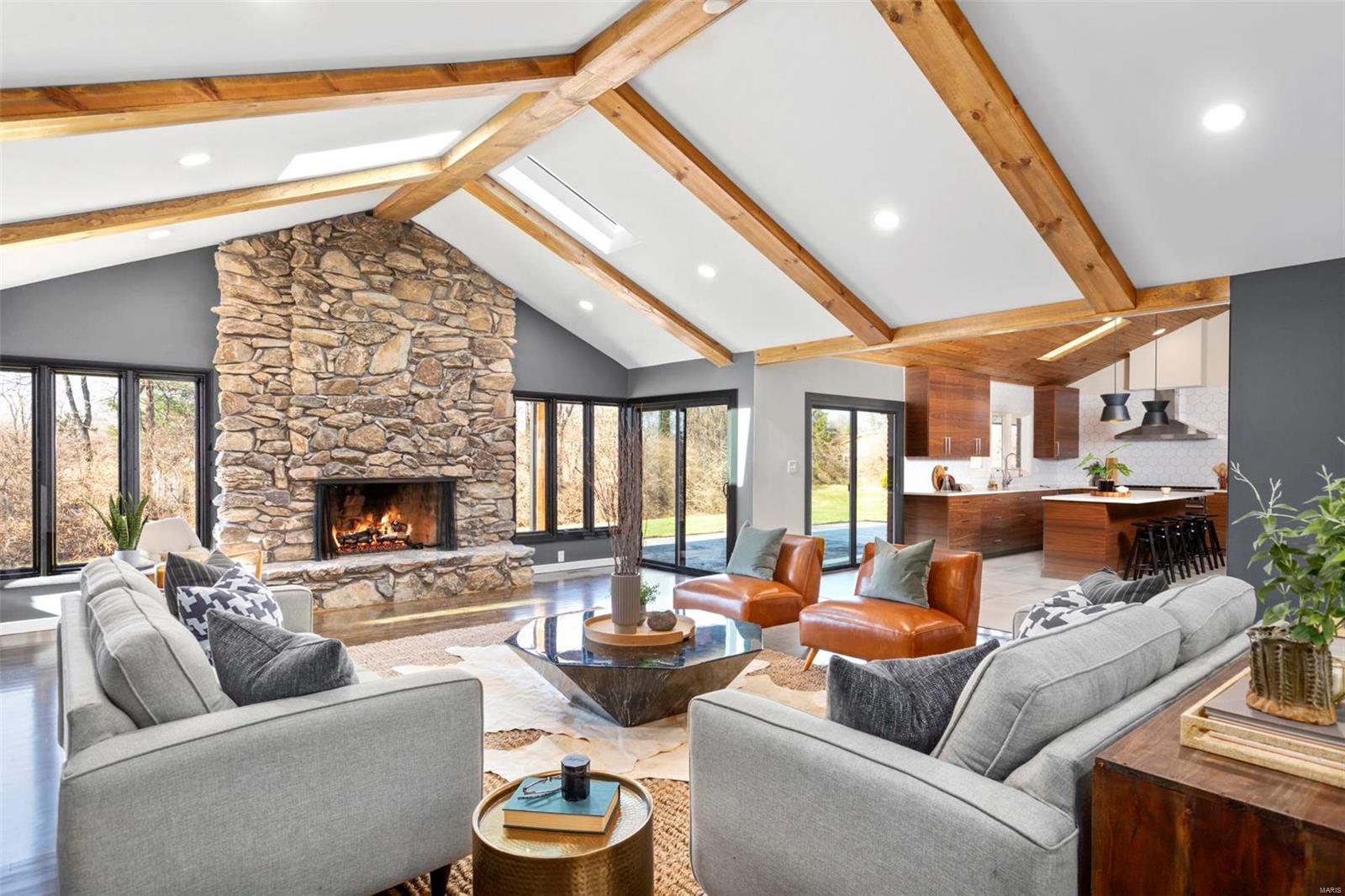 ARCHITECTURAL ICON mid century home available now after 10 month restoration! Located on 1acre in highly coveted Chateau Ladue West, situated on a sprawling acre this beautiful home is truly unique. Main level boasts an oversized great room with breathtaking floor to ceiling stone fireplace opening to the gourmet dream kitchen with stainless steel appliances; separate dining room, large master suite with (fantastic master spa bath w/dual floating vanities, and dual walk in shower), 2 large bedrooms with full hall bath also w/ dual floating vanities. Fourth bedroom with half bath and large first of 2 laundry rooms complete main level. Lower level - 2nd great room with Floor to ceiling fireplace, 2nd dream kitchen w/stainless steel appliances, 5th bedroom ensuite with full bath and big walk in closet. Additional Bonus Room perfect office or 6th bedroom also w/full bath. 2nd laundry lower level. Circular drive, huge 2 car garage, HIGH END FINSISHES, ALL NEW plumbing electric & 3 zone HVAC