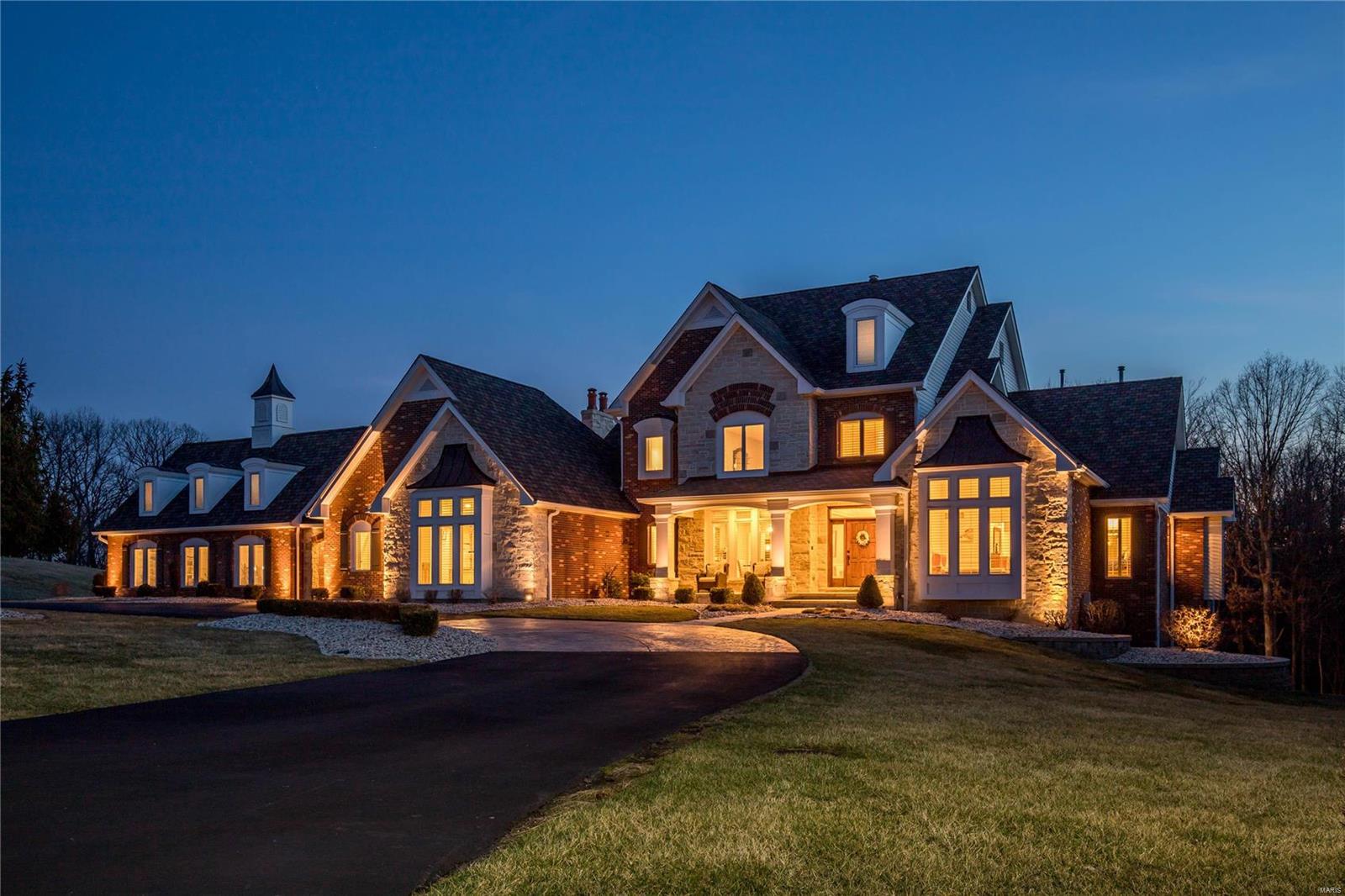Exquisite Johnson-built Estate home on 3-ac grounds! Over 9000 sf of living space enhanced by distinctive architectural elements throughout. 2-Sty hardwood foyer leads to elegant dining room & spectacular great room with wet bar, marble fireplace, built-in bookcases & expansive windows with private wooded views. Designer kitchen with 42” cherry cabinetry, granite countertops, commercial grade appliances & butler’s pantry adjoins sunlit breakfast room with breakfront & vaulted hearth room highlighted by stone fireplace. Coffered master bedroom suite with marble bath with Jacuzzi & adjacent study offers an appealing retreat. Golf room features wet bar, putting green & cart storage. Front & rear staircases access 3 additional bedrooms, 2 with Jack n’ Jill bath & 1 with ensuite bath. Lower Level includes recreation room, billiard room, media room, game room & 1 ½ baths. Situated on a premium cul-de-sac lot with deck, patio, fire pit & wooded walking paths plus porte cochere & 3-car garage.
