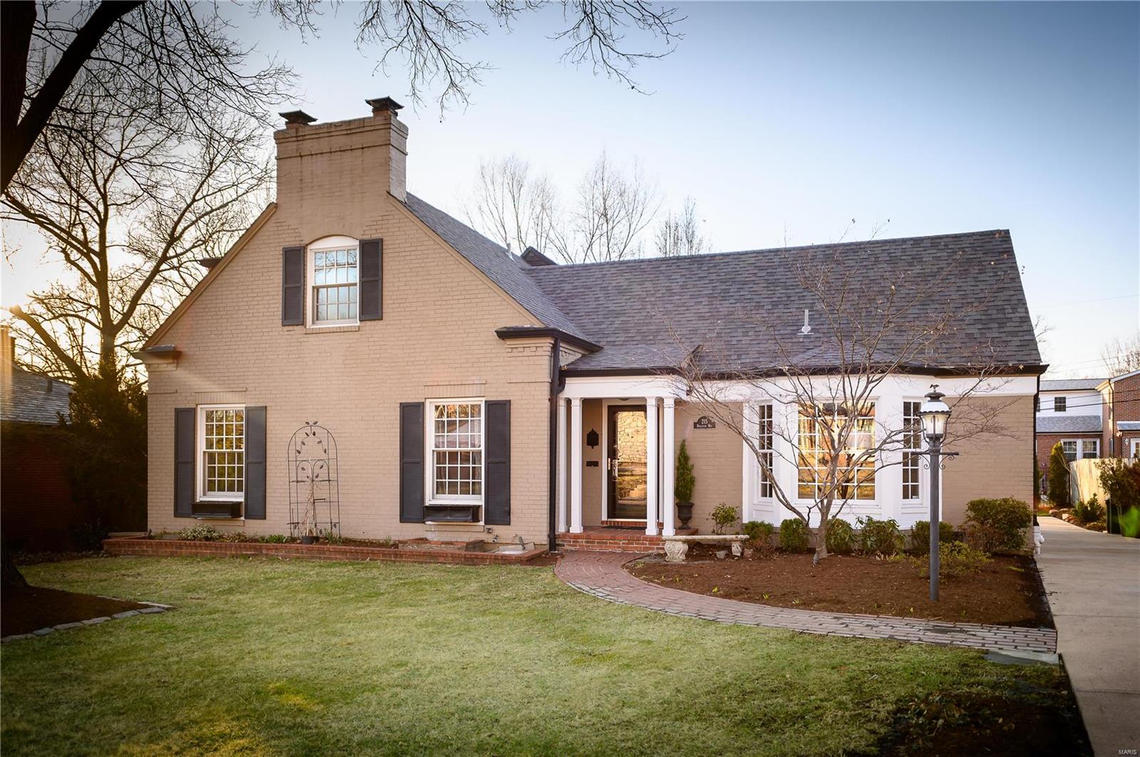 You don't want to miss out on the allure of this 1.5 story brick home in the established neighborhood of Clayton Gardens. The vaulted ceilings and skylight in the Hearth Room allows light to radiate throughout the home. All the rooms flow seamlessly accentuating the open floor concept and recently refinished hardwood.  With the Master Suite on the main floor this home makes living easy. The kitchen offers stainless steel appliances, granite counter tops and a gas cook top. Just outside the backdoor is a large deck and fenced in backyard perfect for entertaining. The home also features the gas fireplace in the Hearth Room with built-ins. 3 additional bedrooms and 2 full bathrooms on the 2nd floor.