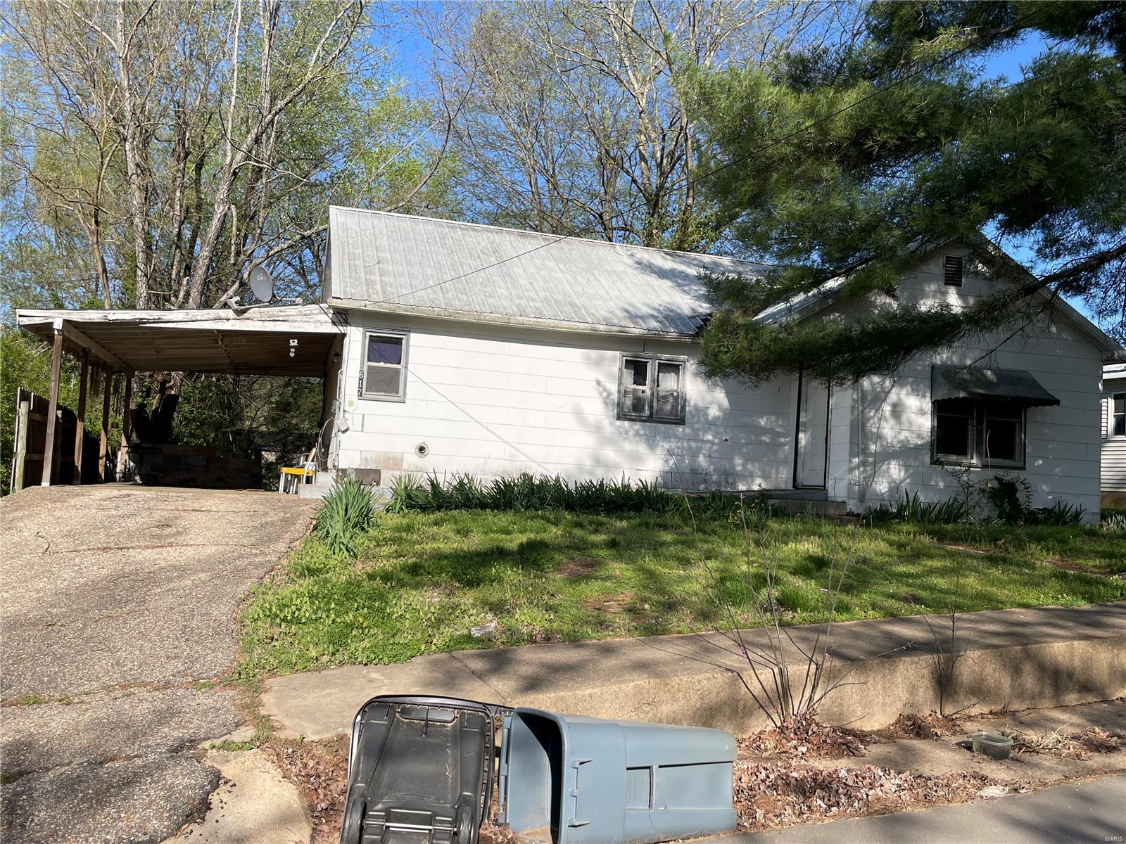 Nice, shaded yard, 16 x 22 storage shed/garage and attached carport. House with roomy living room, eat-in kitchen with built-in storage cabinet, laundry room, 3-bedrooms and 1-1/2-baths. Metal roof, city utilities, all electric. Good rental opportunity.