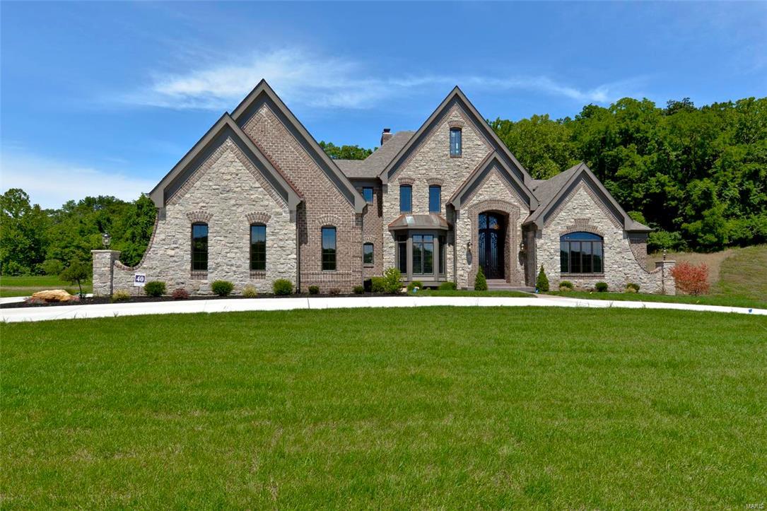 New Construction, Chesterfield, Rockwood Schools! SPECTACULAR 1.5 Story Home  in The Arbors at Kehrs Mill! Crafted by St. Louis' premier hands-on builder, Claymont Development, LLC-Wesley Byrne. The "Kennedy" is a sensational 4BR, 6bath home w/over 6,000 sq ft of exquisitely finished living space. Featuring a warm blend of brick & stone elevation, impressive Elegante Iron entry door, extensive millwork throughout, Andersen wood windows, 10' first floor ceilings w/ 8' doors, 4-car side entry garage; Gourmet Family-Sized kitchen featuring custom cabinets, Thermador SS appliances, granite counters & Breakfast Room + Hearth Room! Luxury MF Master Suite features whirlpool tub w/sep shower plus His & Her closets. 3 beds & 2 full baths don the upper level; Nest Thermostats; Tankless HWH; Photos are to demonstrate the quality of the finished product and may not be an exact representation of this home.