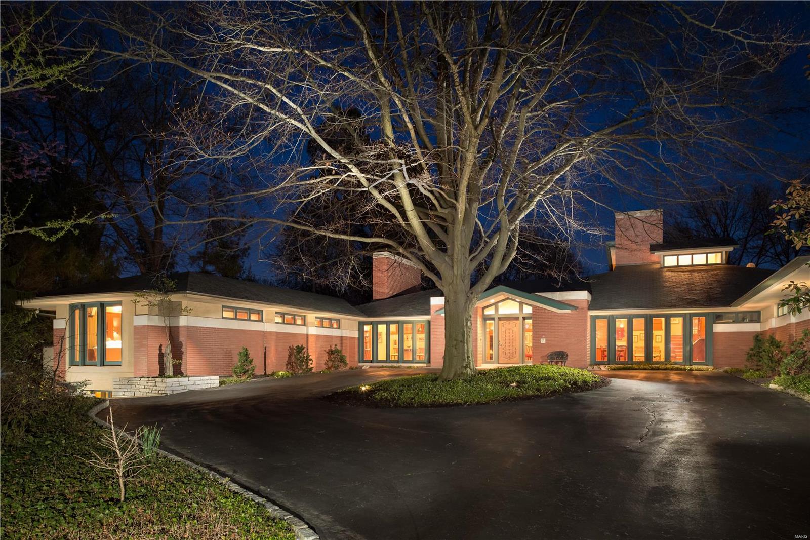Fresh New Look.  This 26 yr old custom mid century modern masterpiece truly invites the outside in.  Situated on almost 2 private acres on prestigious Warson Hills w/ sweeping lawns, raised terraces & pool. Impressive main floor boasts an Open floor plan w/ Soaring Ceilings, Floor-to-Ceiling windows, & Exceptional Millwork. This home was made for Entertaining w/ huge GR leading to formal DR & wet bar. Transition into the Gourmet Kitchen w/ massive center island, beautiful views of the grounds, sitting room & tremendous counter & cabinet space. Main flr Primary bedrm w/ bay window, balcony & luxury bath w/ his/her closets. Add. ensuite bedrm or Office on main floor.  Huge mudroom w/ half bath & built-ins off the 4-car garage. Upper level features 2 spacious ensuite bedrms w/ fabulous views. Walk-out lower level family room w/ bar & FP + Add. lower level offers 2 full baths, laundry rm, rec. rm & 2 BR’s w/ office. This home offers privacy & luxury living in Ladue. Additional Rooms: Mud Room