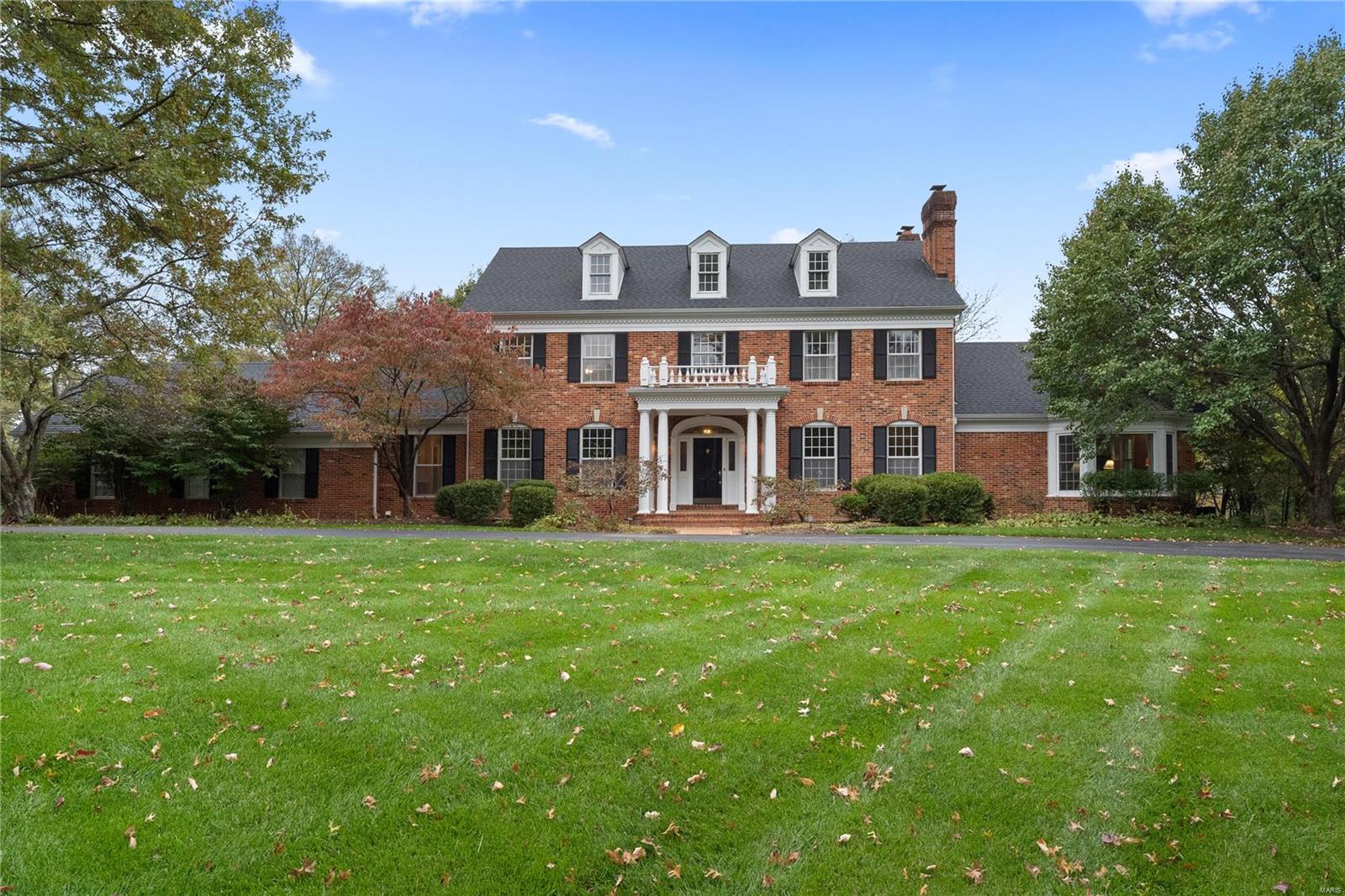 A REWARDING ESCAPE PEACEFULLY SITUATED: Elegant colonial in the award-winning Ladue School District, this 5-bedroom, 5- bathroom home of 5,149 sq. ft. rests on a lot of 1.05 acres (per county) on a peaceful cul-de-sac in the Steeplechase Lane neighborhood. Richly-appointed spaces include large gathering areas with some millwork and built-in bookcases, professional-grade kitchen, elegant dining room, main floor master suite, main floor laundry, 3 fireplaces throughout, a spacious workshop, workout room, rec room that doubles for theater room and a 3-car garage. Not to mention an abundance of storage. The expansive backyard is in private, verdant surroundings. You’ll appreciate the short drive to downtown Clayton, Plaza Frontenac, access to I-64, and numerous country clubs.