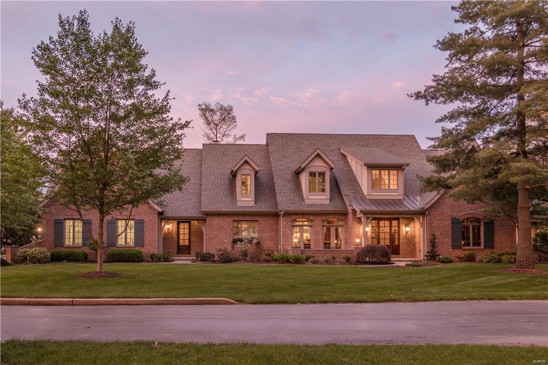 A masterpiece of craftsmanship & detail in design puts this home in a class of its own.The dramatic wrought iron curved staircase sets the stage as you enter flanked by the elegant dining room w/coffered tray ceiling & a stately library w/custom woodwork, fireplace & vaulted ceiling.The 2 story great room allows for both formal & casual entertaining.Truly the heart & sole of the home the gourmet kitchen boasts custom cabinetry, top of the line designer appliances & center island w/breakfast bar opening to a wonderful hearth room w/a fireplace flanked by built-ins.Master suite has a luxury bath w/bain ultra spa tub & heated floors.A private in-law suite w/walk in shower rounds out the 1st floor.The 2nd floor has a Juliet balcony overlooking the 2 story great room plus 3 additional bedrooms & 2 full baths. Located on over an acre w/an executive swim spa & waterfall, walled brick patio, custom finishes & millwork throughout complete the luxuries you would expect. Additional Rooms: Mud Room