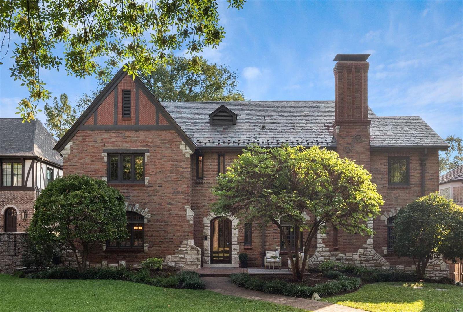 Classic center-hall Tudor in highly sought-after Claverach Park! Slate roof, elaborate masonry work, embellished doorways, & decorative moldings. Oversized front foyer, LR features a sizable gas fireplace, beautifully ornate ceiling & wood paneling. The DR has stucco walls & lead windows. An expansive eat-in kitchen renovation in 2020 incl. ice maker, SS appliances, light green granite countertops, custom cabinetry, breakfast bar & French doors that lead out to a brand new composite deck. The 1st floor additionally has a remodeled 1/2 BA, light-filled bonus room & office. Open staircase to 2nd floor w/ a primary suite- updated BA & en suite for laundry. 3 additional BRs on the 2nd floor & another full, remodeled BA. The 3rd floor was finished in 2012 & serves as a rec room/5th BR w/ a Murphy bed, full BA, oversized closet, bookshelves & skylights. The LL has a main laundry area, newer full BA & ample storage space. An oversized & level backyard complete w/ a Sport Court & lighting.