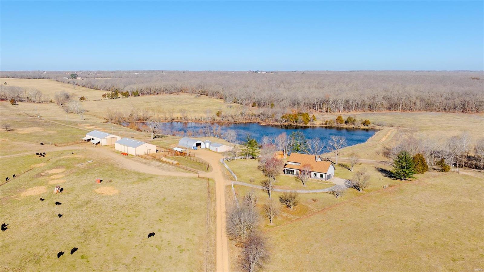 The H and H Ranch is an incredible 405 +/- acre retreat nestled in the picturesque landscape of Maries County, just outside of Belle. A true embodiment of rural elegance, offering a magnitude of opportunities for both leisure and livelihood. Designed with versatility in mind, it is perfectly tailored for cattle operations, boasting miles of 5-strand fencing, steel fence and panel, working pen, cross fencing, and a strategic rotational structure. Abundant water sources, including live streams, multiple wet weather creeks, and plumbed waterers, ensure that your livestock thrive in comfort. Nature enthusiasts will revel in the rich biodiversity of the surroundings. Its sizable lake is stocked with a variety of quality fish. The large block of timber and timber-lined creek draws navigate the flourishing deer and turkey right where you want them. At the heart of the estate stands a charming, meticulously crafted 3bed 3bath home spanning two levels, accommodating the perfect family living.
